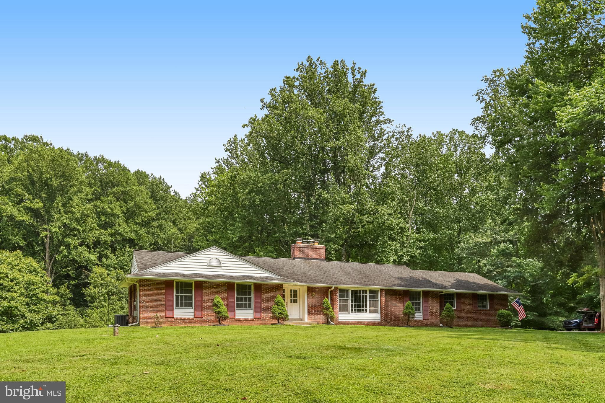 Rare opportunity in the highly desired Fox Haven community — a truly tranquil, mostly forested enclave of only 26 homes, all on very large lots, set well away from Clarksville Pike, and accessible via a long, shared private road. On the main level, this meticulously well-maintained rambler, on a 5.3 acre lot and 1/2 mile from Clarksville Pike, includes 3 spacious bedrooms and 2.5 bathrooms, and features a new screened porch and deck perfect for enjoying the quiet outdoors. The family room, with its fireplace with wood burning insert, is like it was made for cozying up on a winter day. And, the spacious living room, with its own fireplace, and adjoining dining room is ideal for entertaining friends and family. The laundry room, conveniently on the main level, makes this home truly a one-level living experience, if that's important to you. The high quality oak floors throughout the main level have just been lovingly refinished and look absolutely gorgeous. There's an over-sized 2-car garage, with additional parking spaces just outside, at the end of the driveway. The huge, walk-out, unfinished lower level, with large sliding glass doors out to a covered patio and the rear yard, offers ample opportunity to significantly expand the home's finished living area, if desired. Outside, being far from the main road and with few neighbors, you can enjoy the peacefulness 24/7 and the stars at night. There's a large shed and separate carport structure — great for keeping large equipment or other items out of the weather — plus a large gardening plot and over a half dozen mature fruit trees. Finally, there's a cleared path, about 800 feet long, that goes nearly to the back of the property, through pristine woodland and ending at a meandering stream — it's like your own totally private nature trail. The house includes a regularly serviced whole house backup generator, HVAC system newly installed in 2023, and new electrical panel installed in 2025. Overall, this home provides a lifestyle and quality of life — both inside and outside — that can't be beat. This is the one!