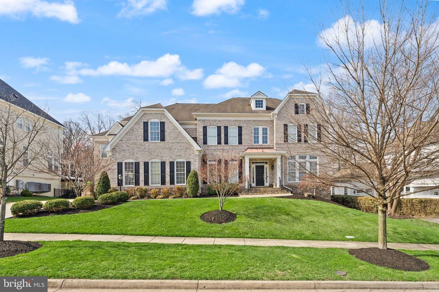 Open House Saturday April 4th 2-4pm**Expansive Lansdowne Estate with Pool and Privacy. This is the rare property that truly has it all! Set on a cul-de-sac street in Lansdowne on the Potomac, this 8,000+ square foot residence sits on a premium lot of over one-third acre with ideal access to neighborhood schools, all backing to mature trees for exceptional seclusion. More than $350,000 in recent updates reflect the finest craftsmanship throughout, with every detail thoughtfully maintained and upgraded. Tree-lined streets lead home to a picturesque property with a two-stall, three-car garage and manicured landscaping surrounding a stately brick facade. Inside, the covered entry opens to a dramatic double-height foyer with sweeping stairs and art-quality lighting above. New and refinished hardwood floors flow throughout the main and upper levels, while generously sized windows fill the formal living and dining rooms with natural light for both entertaining and everyday relaxation. The main level includes a private home office as well as a bedroom suite with full bath, providing a versatile option for multigenerational living. The heart of the home is an open concept chef’s kitchen, completely remodeled in 2023, which flows seamlessly into the family room, a sunroom breakfast area, and out to the screened porch for three seasons of outdoor enjoyment. The family room offers a fireplace beneath coffered ceilings and tranquil tree views. Upstairs, the primary suite is a retreat unto itself. A palatial bedroom features tall tray ceilings above a three-sided fireplace, a sitting area with deluxe coffee bar and fridge, and two walk-in closets with professional organizers. The primary bath includes a soaking tub, dual vanities, and a walk-through double shower for a true spa-like experience. Four more spacious bedrooms on this level each have direct access to one of three full baths, alongside a conveniently located laundry room, with separate stairs leading to a private in-law suite above the third-car garage. The finished lower level is built for living and entertaining, with an expansive recreation room featuring a fully equipped bar and kitchenette, fireplace, full-size daylight windows, and a walk-out to the backyard. A home theater room, gym and exercise studio, large legal bedroom with adjoining full bath, and powder room complete this level. Outside, the backyard is an oasis. A sparkling pool and secluded hot tub are surrounded by sun-kissed hardscape and a fire pit gathering area, all fenced and embraced by mature landscaping backing to woods. A side yard with lawn and gated access from the front adds even more usable outdoor space. Additional updates include two new HVAC units (2022), updated lighting throughout (2022), a whole-house steam humidifier (2024), and a new water heater (2021). The coveted community of Lansdowne on the Potomac offers first-class amenities including indoor and outdoor pools, a fitness center, playgrounds, sport courts, a ballroom, and more. Enjoy easy access to Route 7, Lansdowne Town Center, the Golf Club at Lansdowne, Lansdowne Resort and Spa, One Loudoun, hiking trails, and Bazil Newman Riverfront Park. With every amenity at your doorstep, this is estate living at its finest.