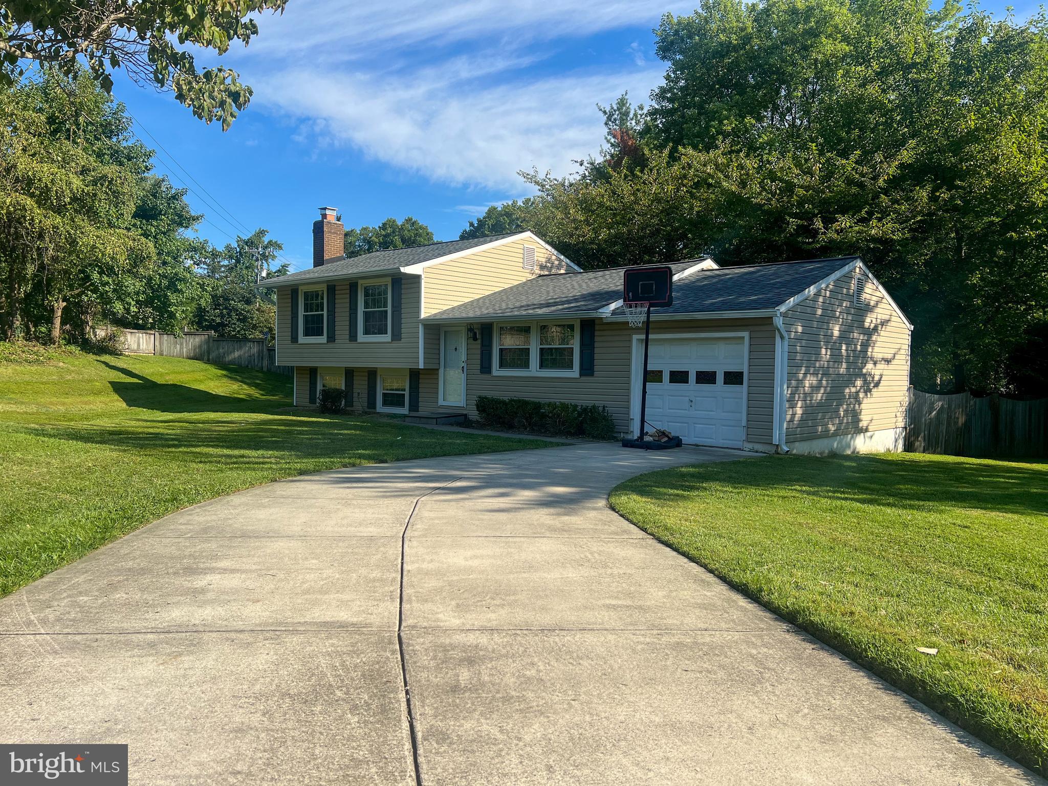 RARE OPPORTUNITY in Vienna with easy access to all major transportation hubs and less than ½ mile to Chain Bridge Rd/Maple Avenue, the main street of Vienna. This 3 bedroom, 2.5 bath home features updates throughout and is situated on a spacious 12,500+ square foot lot. The open main level boasts a bright living room, an updated kitchen with stainless appliances and a large island with seating, as well as a separate dining area. The open floor plan is perfect for entertaining! Head upstairs to the 3 bedrooms, all with hardwood floors. The primary bedroom includes an updated full en-suite bathroom. An updated hall bathroom completes the upper level. The fully finished basement features a large recreation room with a fireplace, large finished laundry/storage room, and a half bath. Many updates throughout: kitchen appliances, cabinets, countertops, and lighting; bathrooms; recessed lighting; gorgeous hardwood floors throughout the main level and upstairs. 1-car garage. The fully fenced backyard is perfect for pets, playing, or a private cup of coffee in the dappled shade of the mature hardwoods. Very conveniently located on the western end of Vienna. Just minutes to all the shops, restaurants, parks, and entertainment of Vienna. 10 minutes to George Mason University, Merrifield/Mosaic District, and Army Navy Country Club. COMMUTER’S DREAM: 5 minutes or less to Rt. 123, I-66, Rt. 50, Rt. 29, and the Vienna Metro Station. MOSAIC ES, THOREAU MS, OAKTON HS