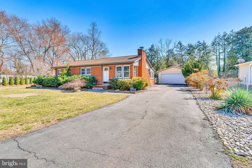 All Brick one level home that has been completely remodeled inside from granite countertops, to stainless steel appliances, cream colored cabinetry that run all the way to ceiling, built in overhang for barstools, wood floors throughout bedrooms and into formal living room, beautiful tiled bathroom with built ins. Home also features spacious bedrooms, formal living room with stone fireplace, step down family room, 2 car detached garage with garage opener, large shed, and a meticulously landscaped fenced in yard. 

This one has it all! walking distance from Dahlgren Naval Base, Machodoc Marina, and minutes away from Harry Nice Bridge.