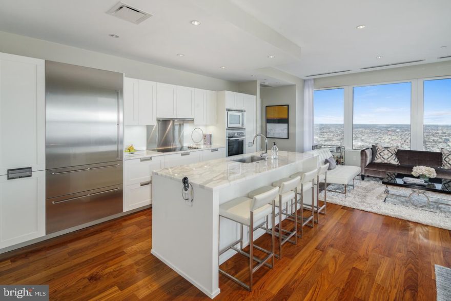 Unit has partial tax abatement. Live in this gorgeous corner unit where Luxury living has reached new heights in Philadelphia at The Residences at Two Liberty. Five-star amenities and concierge services are yours the minute you arrive. Enter the private resident's lobby with door staff and concierge, at your service 24/7. Elevators with fobbed access provide entrance to your residence as well as the 38th floor amenity level. North and East facing apartment with Spectacular River, City and Sunrise unobstructed views in this luxurious corner unit floor plan including 3 Bedrooms and 3.5 baths. The apartment features a contemporary plan with hardwood floors, walls of windows throughout, and an open living room, dining room and kitchen which offers spectacular views of the city. The finishes are of the highest grades including a gourmet kitchen with granite countertops, Snaidero cabinetry and built-in stainless Miele appliances and a Sub-zero refrigerator. Master bedroom suite includes a luxurious marble bath w/ glass enclosed shower and separate tub, dual vanities, and a generous walk-in closet w/ built-in organization. Second bedroom has en- suite bath and additional walk in closet. The laundry room has further storage and high efficiency stacked laundry, and a large powder room. With the finest amenities, there is access to a 24hr fitness center/spa with endless pool, steam showers, sauna, yoga studio and massage rooms. There is a business center with board room, media and billiard room, a chauffeured town car and room service available.. For your convenience, valet parking is available at an additional fee. Liberty Two is in the heart of Center City and surrounded by the best shops and restaurants with access to Rittenhouse Square, Dilworth Park, and the Benjamin Franklin Parkway with world class museums. Unit has partial tax abatement