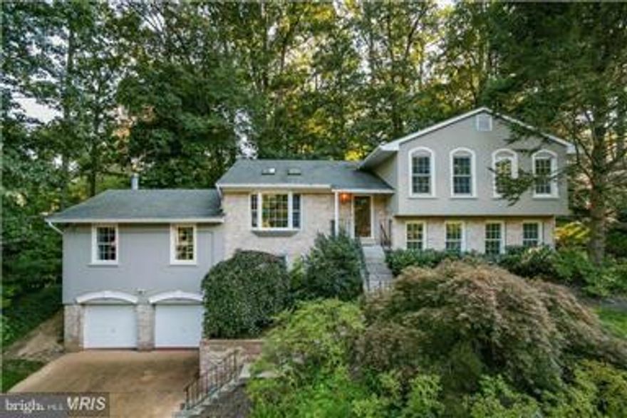 Open, Airy, Updated Contemporary w/ an exciting flexible floor plan easily accommodates multiple generations under one roof! With spacious central living space walking out to a huge deck in the private tree draped yard, the lower levels increase the available space w/ two rec rooms, a den and au pair suite. Located in this popular close in community, there is EZ access to GW PKY, MD and DC!