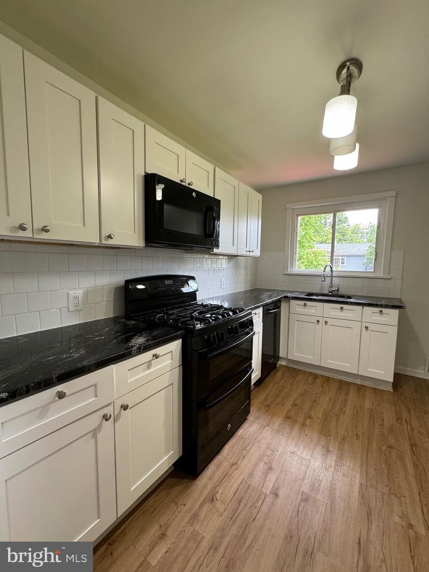 Charming Renovated One-Level Home in Prime Location! Single-family home offering convenient one-level living close to major highways, commuter routes, shopping, and more. The home features 3bedrooms, 1 full bath, and a large, flat backyard perfect for outdoor enjoyment. The bright kitchen includes  a stove, microwave, dishwasher, and refrigerator. A separate utility room includes a washer and dryer for added convenience.  The pet Policy: One small pet allowed (maximum 15 lbs) with a $500 deposit.