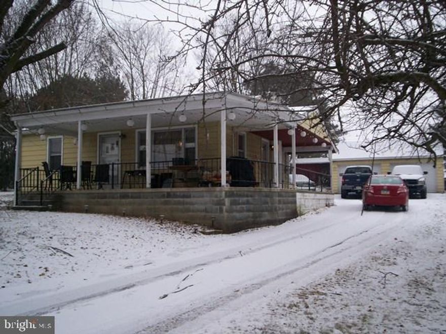 up for sale is this 2 bedroom ranch home located 10 minutes from Lewistown and 30 minutes from State  College. The lot features a wrap around driveway with a 2 car garage. the inside has a newly remodeled bathroom, kitchen and living room (with a pellet stove).; refinished hardwood floor along with new flooring throughout the house. It also has a full basement with outside entry.