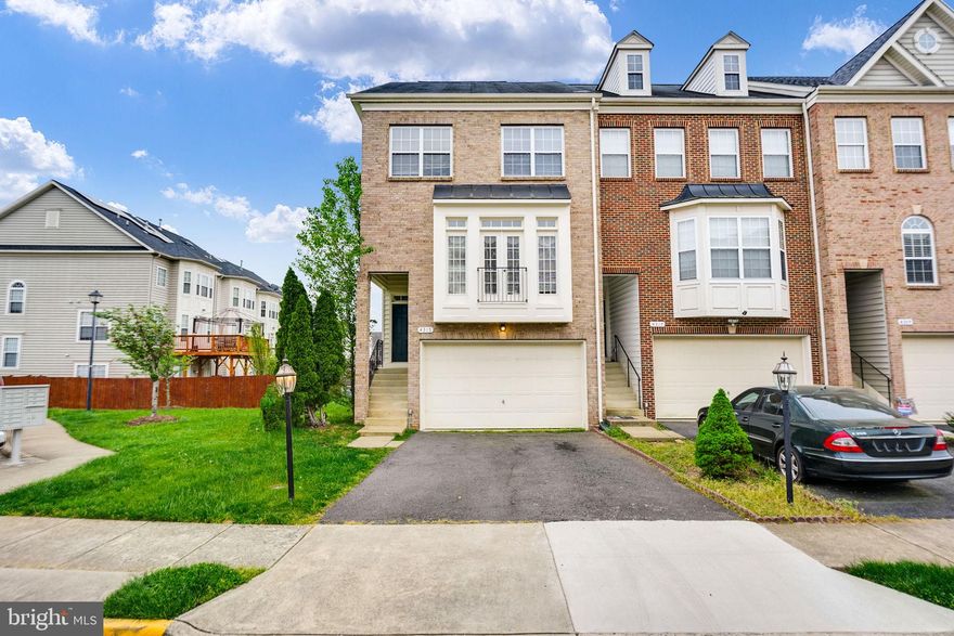 Luxury end unit townhome, 2 car garage, bump outs allow for over 2400 sqft of living space, elegant columns separate living and dining room, gourmet kitchen with island and cooktop, double ovens, microwave, sitting area/den, huge master bedroom suite with luxury bath, walk-in closet, lower level has a fireplace and walk out.