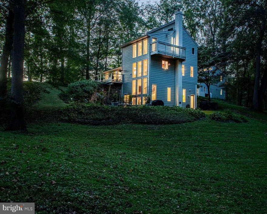 Seeking a peaceful and tranquil setting? Does waking up to a quiet meadow view from your bedroom's floor to ceiling windows sound amazing? This is an opportunity to own a custom, contemporary home in the Unionville Chadds-Ford School District with a West Chester mailing address. This special property consists of the main home, the detached 3 car garage and the apartment over the garage. ▪️This one of a kind home sits on 2.5 acres, with 3 stories of floor to ceiling windows that bring inside natural light and the beautiful meadow with wooded surroundings. Vaulted ceilings, and floors that open to the level above, make this 2158 square foot ($304 sq. ft.) home feel much larger. The lower level, 400 sq. ft. family room features heated porcelain 2x2 tiles and a walk-out sliding glass door to the large slate and cobblestone courtyard. The bathrooms are all upgraded including travertine floors. Hardwood floors have been installed throughput the rest of the home. The second floor primary has an in-suite private bath with heated floor and a custom walk in closet with additional storage above. Bedroom two, also on the second floor, has a vaulted ceiling and loft space. The close by full bath has frameless shower doors and a jetted tub and heated floor. Bedroom three, is on the first floor. It features a wall of built-in hardwood cabinetry and a double closet. Next to it is a full bathroom with floating sink cabinet, frameless shower and linen closet. The large office space features floor to ceiling windows and a sliding glass door to the front deck. The half bath is on the first floor off the hallway. Having been completely renovated with quality upgrades and numerous amenities, this unique gem is set apart from any other. ▪️The "Loft" is a detached 1000 square foot luxury guesthouse over the garage. It is a totally self contained apartment with a full kitchen, huge bathroom and oversized closet with lots of storage, and jetted tub. It features dual mini-split AC and under the floor heat. It has been a very successful 5 star luxury vacation rental, but is well suited for other applications. ▪️The 'Loft" apartment sits over a 1080 square foot 3.5 car garage. Well suited for a classic car collection it also has in-floor radiant heat. With over 130 square feet of shelving storage space there is always room for your vehicles. The garage also features a powder room, shop sink, epoxy coated floors, all doors have electric openers and one bay has a 9' high door. ▪️This private and peaceful property is bordered on 3 sides by deed restricted properties, placed in conservation.