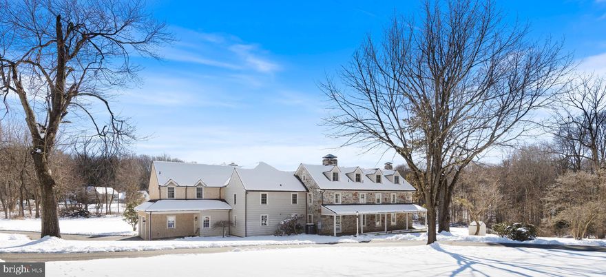 Welcome to Green Lane Farm! Sited on a private 4.2 acre parcel of ground, this amazing Pennsylvania Dutch stone farmhouse has been completely restored & expanded within the past 20 years. Tucked away from the crowds, the property is surrounded by other estate sized properties and horse farms yet is only 5 minutes from access to Route 202 for easy commuting north or south. Originally constructed by George C. Clemens in 1789 as the primary home of a 112 acre working orchard & farm, the home has been expanded in 3 distinct phases. The original portion now comprises one large open-plan living/dining room on the first floor with a new wood stove inset into the former hearth. On the 2nd floor is a private guest bedroom & hall bath while another bedroom & en-suite bath is on the 3rd floor. The 2nd addition from the 1820’s added an entry foyer (now with a powder room & coat closet) on the 1st floor & what is now another home office on the 2nd floor. The kitchen addition was constructed in the 1930’s with another guest bedroom & hall bathroom above. The current owners undertook a massive restoration & expansion of the property in 2003 to combine all of the historic elements with today’s modern needs. Over 2,200 SF of additional living space was added to the house that incorporated a large family room with a wood burning fireplace, a home office, full bathroom, laundry and an attached 2-car garage on the first floor. The rear wall of the kitchen was removed to provide one large entertaining space with direct access to the rear patio and yard. A small covered porch is just off the laundry. The second floor of the addition is the primary suite that incorporates two large walk-in closets, a walk-in linen closet and a primary bathroom that includes a private toilet room, two separate vanities, a walk-in shower and a slipper tub. The kitchen was also completely remodeled at this time and provides an abundance of storage solutions, from the massive double-sided island to the two pantry closets and all of the cabinets that flank three of the walls. The kitchen sink overlooks the front yard and there is a Bosch dishwasher. A 36” Bluestar professional stove anchors the north wall. A Subzero fridge is tucked into one corner, while a 2nd Heartland fridge is located on the western wall. A built-in Gaggenau microwave is located next to the 2nd fridge. Even with all of the various storage solutions, there is also room for a large farmhouse table that can accommodate 8 seated for casual meals. The open plan concept of the home office could be another dining area, but it sure is a great place to work, with the best view from the house out to the pond beyond. The basement within the 2003 addition was plumbed for a bathroom if needed in the future. A significant portion of the rear yard has been fenced. The house’s primary roof was replaced in 2016, as was the addition of a standing seam copper roof on the porch. A new septic system was installed in 2018. All of the 3rd floor dormer windows were replaced in 2009, while 2 additional windows on the 2nd floor over the kitchen were replaced in 2018. The remaining original windows in the older portion of the house were completely stripped and resealed in 2002. The systems were designed for energy efficiency with 7 heating zones, and 5 air conditioning zones. One can easily adjust the temps in portions of the house when not in use. In addition to the attached 2-car garage, the detached garage can accommodate an additional 4 vehicles. The current owner is using this space as a woodshop, yet all of the equipment and workbenches will be removed. There is also a wood burning stove in this garage and a large pull-down staircase/ladder to access the 2nd floor where there is additional storage space with a rear door to the yard. Attached to the side of the garage is another workshop area. Come explore Green Lane Farm, you will fall in love with the perfect combination of historic charm and modern amenities.