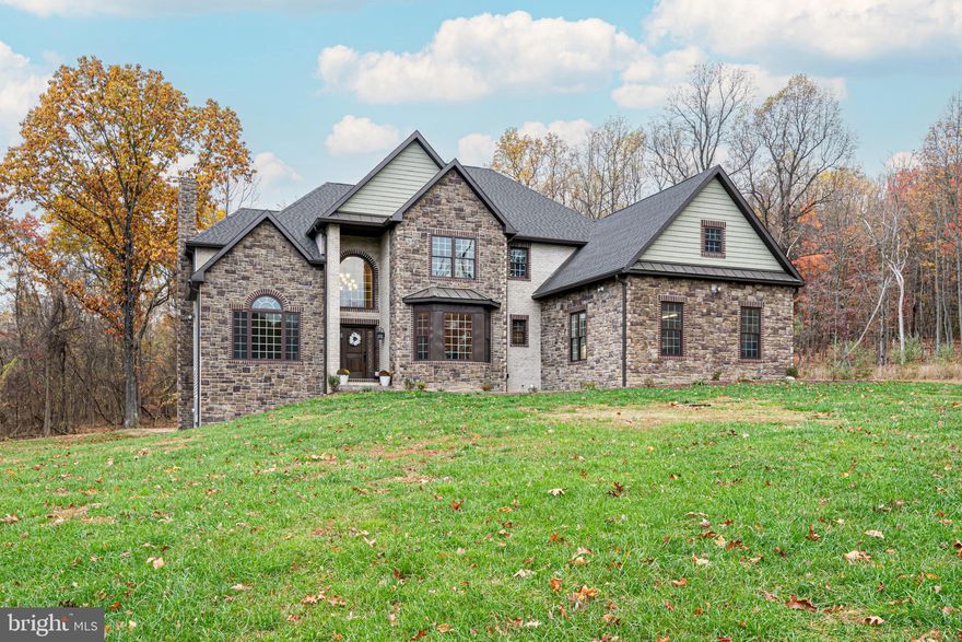 Welcome to a truly opulent retreat in the prestigious Waterside Reserve subdivision of Harpers Ferry, West Virginia. This custom-built masterpiece, set on 10 acres of picturesque landscape, offers an unrivaled fusion of luxury, space, and natural splendor. A grand three-car garage and exclusive river access set the stage for a lifestyle of lavish indulgence, perfect for those who crave both elegance and outdoor adventure. The heart of this residence lies in its gourmet kitchen, a haven of culinary artistry featuring top-of-the-line stainless steel appliances, dazzling granite countertops, and a generously sized eat-in area with an oversized island—an epicurean's paradise. The inviting family room boasts a charming wood-burning fireplace, providing a cozy backdrop for gatherings and relaxation. The main level reveals a sumptuous primary suite, complete with a capacious walk-in closet and a lavish ensuite bath for the ultimate in comfort and convenience. A den, laundry room, formal dining room, and gracious living room complete the main level, offering versatile spaces for work, play, and entertainment. As you ascend to the upper level, discover an additional bedroom suite with its own ensuite bath, along with three more impeccably designed bedrooms and two full bathrooms, each outfitted with walk-in closets, ensuring ample storage for all. While the lower level is currently unfinished, it is thoughtfully planned for the addition of three extra bedrooms and two full bathrooms, providing an open canvas for creating your bespoke luxury haven. This exceptional residence not only offers an opulent living space but also grants access to the serene beauty of Harpers Ferry, with its rich history and awe-inspiring vistas. This property offers a strategic location, it's an ideal haven for commuters, being a mere 15 minutes from the MARC train station. Additionally, the residence is strategically positioned, offering a quick 30-minute drive to both Leesburg, VA, and Frederick, MD. Enjoy the perfect balance of luxurious living and seamless accessibility in this prestigious Waterside Reserve subdivision. Embrace the opportunity to make this extraordinary property your sanctuary, where every day promises a luxury experience beyond compare.