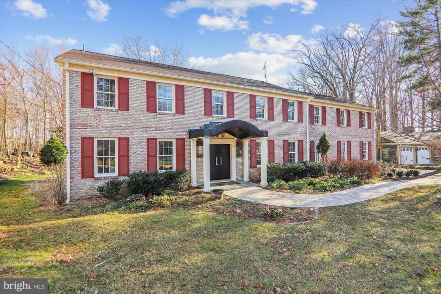 Welcome to this incredible almost 6200 sq ft, 6 Bedroom, 4.5 Bath Coloniel brick home in Layhill Village!  You will approach the covered entry to this home on a brick and paver walk way.  This traditional layout include many non-traditional extras.  The front door opens to a large foyer.  Relax in an oversized living room with two banks of window for light.   Enjoy the unique and stunning hard wood spiral staircase illuminated with selectively placed mirrors leading to the upstairs level.   Invite your friends for dinner in the sizable formal dining room that connects to the spacious gourmet kitchen.  The kitchen features SS appliances, granite countertops, backsplashes, gas stove, a microwave, a large island with abundant cabinetry and lots of storage.  There is table space for your morning meals and windows with a view to let in the sunshine.  There is a door in the kitchen leading out to the rear brick patio.  Spend evenings in the family room complete with wood flooring, a wood burning fire place and an amazing wood door enclosed bar.   
The spiral staircase leads to the upstairs bedroom level.  Beautiful, brand new carpet is all throughout the upstairs bedroom level.   This top floor includes the primary bedroom suite on one side.  It has a huge bedroom with a very large walk-in closet and windows on three sides to bring in light.  There is a seperate bathroom with shower on one side of the entry hall and and a wash room with its own closet on the other.  On the other side of the house are two good-size bedrooms with a "Jack & Jill" full bathroom between them.  Add two other bedrooms on either side of the middle of the hall way and a lovely hallway bathroom and you have a 5 bedroom floor with 3 full baths.  Two more special features of this floor is a large and phenominal office/library room on the upstairs floor with beautiful built-in shelves and drawers and a cedar closet for your protected clothing items.
On the lower level you will also find new vinyl flooring and a huge recreation room area perfect for a big screen tv for movie nights and space for a great game room!  There is a very big bedroom with all new carpeting and connected to the bedroom on one side is a full bathroom entry and another door for lower level guests on the other.  There is an emergency exit window well in the bedroom that allows light in and someone the ability to get out if needed.  Additionally, there are two storage rooms for your things, a utility room with an exit door to the outside and storage closets in the lower level. 
This lovely home in this sought after neighborhood is minutes from both the ICC and Glenmont Metro and shopping.  It sits on just under a half acre with a brick paver patio and a lovely back yard surrounded by woods and a walking trail.  Finally there is an attached and oversized two car garage and additional driveway parking for 6-8 additional cars.  
Open House on Sunday, March 10th  from 1-3pm.  Come out and see your new home!!