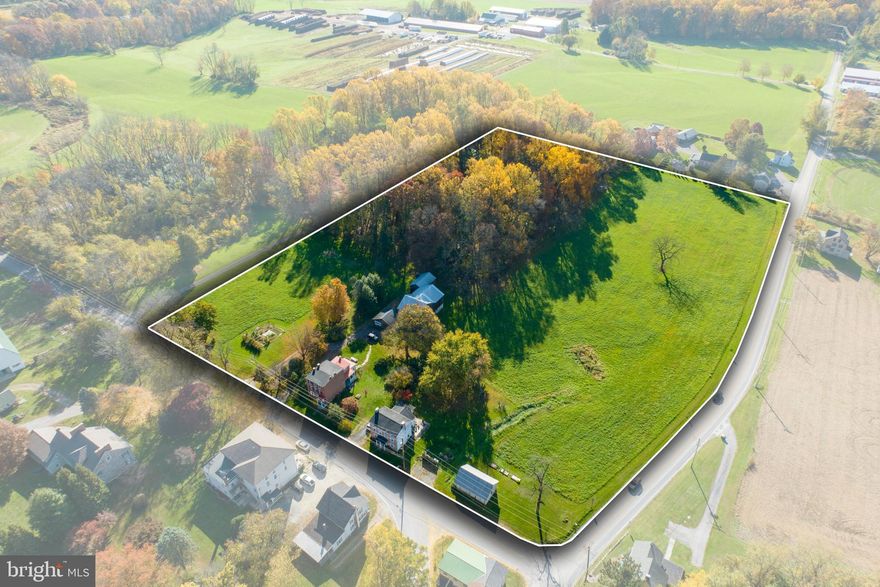 Versatile Opportunity
Nestled among peaceful countryside views and open farmlands, this charming three-story red brick Federal home sits on 11-plus acres, featuring a historic barn, garage, twin three-story rental units and three-bay garage.


Ideally situated in London Grove Village, West Marlborough Township, and within the Unionville Chadds-Ford School District, this property not only offers historical charm but also proximity to the borough of Kennett Square, recent upgrades, and unique opportunities.


The main residence, a Federal-era gem, includes three bathrooms, two bedrooms, a mudroom, dining room, living room, a new walk-in closet, and a full attic. The well-equipped kitchen features stainless fixtures and appliances, a large oven, and an electric ceramic stove top.


The wood-burning stove with updated chimney, exposed beams, and era-specific glass transoms over dining room doors add character and warmth to the living spaces. Explore the rich history within the property, including old-fashioned elements like an icebox, beehive oven, original hardware, and textured decorative paint using feathers.


A convenient ½ bath with a pedestal sink is found on the first floor, while the second floor hosts two full baths, including a clawfoot bathtub and tongue-and-groove wainscoting.


While rooted in the past, the property is equipped with modern amenities, such as a new well and outdoor hydrant drilled and installed in January 2023, a reverse osmosis water system, up-to-date electric, and an oil-burning furnace replaced in 2022 in the unfinished basement linked to steam radiators.


Period features, such as marble exterior windowsills, original wood floors on the second and third floors, and an authentic spiral staircase, add interest. Bright bay windows on the east side of the house invite beautiful sunrises, natural light, and picturesque views indoors. The original west-facing side porch provides an exterior seating area with beautiful sunset views. 


The neighboring twin house features two dwellings, each with two bedrooms, one full bath, a kitchen, a comfortable living area, and a basement. This presents a great rental opportunity, making it an income-generating asset.


Spanning 11-plus acres, the property boasts a picturesque circa 1820 post-and-beam barn with an attached garage and new electric. It includes an agricultural pasture suitable for grazing horses and a mature 4-acre wood lot with hardwoods, native plants, and walking trails. On the corner of Newark & Street Roads is a three-bay garage for additional storage or rental potential.


London Grove Village falls under the Village Residential Zone (R-1), as per West Marlborough Township zoning documents. Additionally, the property is enrolled in Act 319, providing tax benefits for qualifying properties spanning over 10 acres.


This versatile space seamlessly blends historical charm with modern functionality, making it a rare  investment.

By appointment only, 24 hour notice for showings.