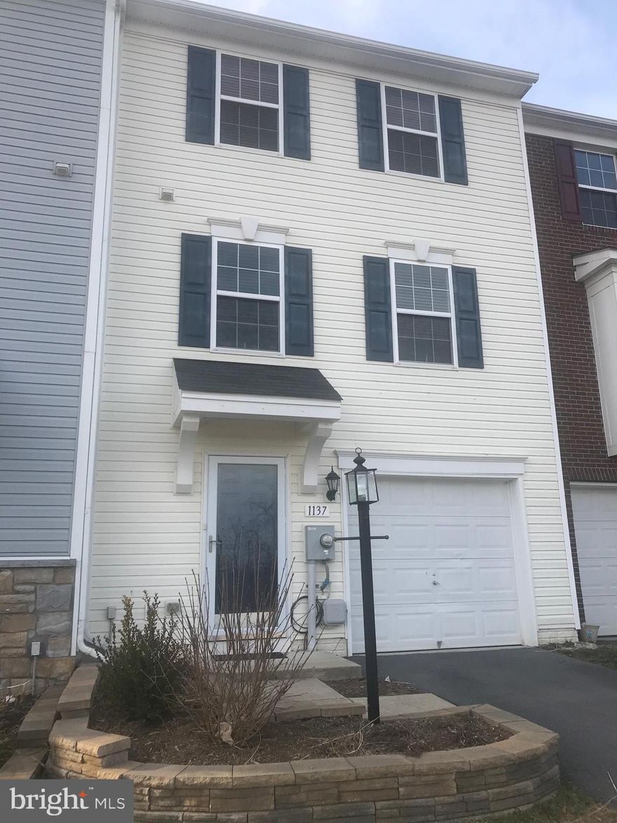 Nicely kept three level town home in the community of Lakeland Place at Fairfax Crossing in Ranson, WV.  This home offers three bedrooms, two full baths and two half baths.  First level has entrance foyer with large coat closet and access to one car garage.  As you continue through the foyer it opens into a nice area that can be used as extra living space with access to the back yard.  This room also houses the walk in laundry closet with built in shelves and closet and nice half bath.  Upon entering the second level, you immediately enter into the kitchen area with beautiful dark cabinetry extending to the ceiling, granite counters and stainless steel appliance.  Enjoy dining in the breakfast nook off kitchen which overlooks your maintenance free trex decking.  When the kitchen closes, enjoy your free time in your generous sized family room with  half a bath attached.  It's time to retire to the third level to your bedrooms.  The master is spacious and holds a King size bed with room to roam.  The ceiling is vaulted and has a walk in closet and a master bath with soaker tub, stand alone shower and double vanity.  This level also includes two additional bedrooms, full bath and linen closet in hallway.  The best reason to buy this town home is it's location/community.  This town home is situated on the only street in the community that has overflow parking at your front door.  Family has extra cars...no problem....guests...no problem!  The community currently has one park for entertainment but the new developer is planning on a few more parks and a possible splash pad for community amenities!  Catch this one while you can!