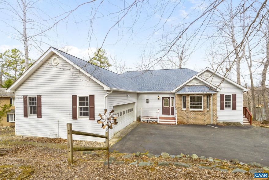 Overlooking Jackson Cove with views to beach 4 and the main lake, this exceptionally appointed custom built waterfront home is sure to please. Privately located on a peninsula with only 2 other houses, this home offers deep water, privacy, yet convenient to shopping. All one level living, the main floor offers open style living with exceptional views. Upon entering, you are greeted with a formal living room with gas fireplace, hardwood floors and cathedral ceilings, large windows and views of Jackson cove. The large eat-in kitchen offers tons of counter space, loads of cabinetry and easy access to the screened in porch. There is also easy access to the formal dining room. The large primary bedroom with tray ceilings, spa like en-suite and morning room or office are also located on the main level along with a second spacious bedroom and full bath. Terrace level includes a large family room, 1 more bedroom a full bath as well as tons of storage, and the possibility of a 4th bedroom.  Outside features a custom built gazebo and bilevel dock with sitting area,boat mooring and deep water. This home is perfect for year round living or weekend/holiday getaways.,White Cabinets,Fireplace in Living Room