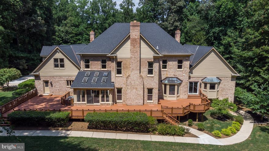 Welcome to 11111 Devereux Station Lane, a breathtaking luxury estate set on 5 acres of professionally designed landscaping, complete with a tranquil waterfall, lush gardens, and resort-style outdoor living—now offered at a dramatically reduced price of $1,920,000. This is your rare chance to own one of Fairfax Station’s most iconic and beautiful properties at an unmatched value. The seller remains motivated and is actively reviewing strong, competitive offers.

This elegant Colonial masterpiece offers over 10,000 sq. ft. of luxurious living:

7 spacious bedrooms, 6 full + 3 half baths

Dramatic double staircase, soaring ceilings, and gleaming marble floors

Chef’s kitchen with granite island & stainless steel appliances

Formal dining room with fireplace – ideal for sophisticated entertaining

Step outside to your private resort, featuring:

Professionally landscaped grounds with a stunning waterfall feature

In-ground pool (valued at $300K)

Two-story pool house with a full kitchen

Tennis court (easily converted to pickleball)

Fitness room with sauna

The fully finished lower level is an entertainer’s dream, including:

Private bowling alley (valued at $80K–$100K)

Custom wet bar

Home theater/media room

The lavish primary suite is a true retreat, offering spa-style comfort and serene views. Additional updates include a new high-efficiency AC system, ensuring comfort and long-term value.

Conveniently located near Robinson Secondary School and commuter routes, this estate combines elegance, privacy, and accessibility.

With over $400,000+ in premium upgrades and irreplaceable features, this estate is a rare find. The seller is motivated and looking for strong offers—schedule your tour today and make this dream estate your reality.