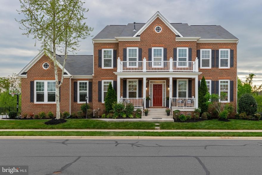 You’re bound to fall in love with this stunning home in the heart of Brambleton!  Welcome your guests through the inviting foyer of this luxury home.  This beauty is situated on a .36 acre lot, fenced backyard, backs to a gorgeous view of trees, and has the most amazing views of sunsets!  This spacious home has a feeling of comfortable warmth with a grand feel.  Need room for casual parties and large scale entertaining?  You’ll find all the space you need for effortless entertaining with an easy transition from indoors to the amazing outdoor space.  Take in a movie in the fully soundproofed theatre, walk out from the main level to a huge party ready deck or step outside from the lower level to the huge patio.  You’ll enjoy the abundance of sunshine coming through the wall of windows on all levels of this home!  The gourmet kitchen is the hub of this home and offers upgraded appliances with a Monogram range hood, huge kitchen island with seating and a breakfast bar.  You’ll be preparing meals to your hearts content.  Kitchen opens to an expansive family room with a gorgeous feature wall of a linear fireplace surrounded by floor to ceiling tile. The sunroom off the kitchen is perfect for relaxing and enjoying the sunshine through all the windows.  The formal living room and dining room with butler’s pantry offers space for more intimate gatherings.  Bedroom on this level can easily be used as an office.  Iron balusters grace the staircase as you head upstairs where you’ll find a magnificent owner’s suite with a separate sitting room, two very large closets and a spa-like bath!  The three additional bedrooms on this level ALL have en-suite baths and walk-in closets!  As you make your way to the lower level, you will be WOWED!  This level sparkles and is ready for entertainment at a moment’s notice!  The possibilities are endless with the modern bar, fully soundproofed theatre, gorgeous linear fireplace with floor to ceiling tile surround!  Your guests will have the time of their life and will never want to leave.  You’ll be able to welcome any of your overnight guests to stay as this level offers a bedroom and a full bath. This home is drenched with sunshine and offers so many upgrades including hardwood floors on main and upper levels, shadowbox and architectural detailing throughout, feature walls, windows galore, iron balusters, bar, theatre, fresh custom paint throughout, 3-car oversized garage, all the Brambleton amenities, and so much more!  Relax, enjoy, and entertain-this home has it all with almost 300K in upgrades after they purchased including a TESLA charger! ***Enjoy everything Brambleton has to offer with neighborhood activities, Brambleton Town Center, fitness center, library, restaurants, movie theatre, shopping, gas station, farmers market, seasonal concerts.  You'll have fun taking in outdoor activities on the walking trails, parks, pools, playgrounds, and so much more!