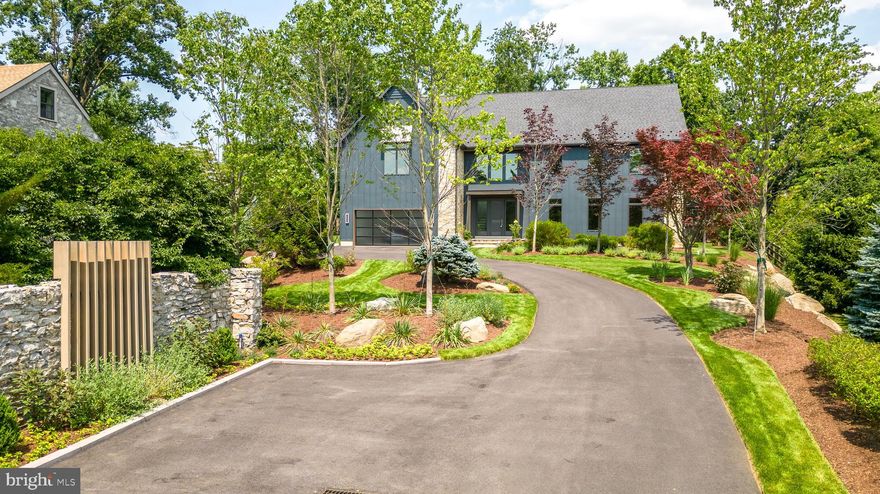 Welcome to Penn Moor- New construction with a forward feel ! -A truly rare find on the Main Line! This Wayne home brings an invigorating spirit of both modern and urban to this highly desired and sought-after historic location.  
This statement build, sits high on its custom designed property with a lush display of trees and shrubbery landscaping along with distinguished hardscape features.
A fresh revitalizing excitement opens at your front door of this 6000+ sq ft home, flooded with beautiful sunlight.
Warm features working with modern elements bring a comfortable and organic luxury to your living. This open floor plan provides the perfect arrangement for both family life and special entertaining. The spacial mingling between kitchen, dining and living areas of this home provides a seamless flow. Gathering together in the kitchen is enhanced with a linear fireplace in view of your oversized counter and well appointed kitchen. An abundance of pantry storage, kitchen dining area, and workstation provides many surfaces and spots for all your family and entertaining needs. A large family room displays a modern themed gas fireplace, full length windows, and multiple options for furniture placement. Also located on your first floor is a private office, a formal powder room and an additional back bathroom.
Upstairs you'll find your master bedroom with a spectacular ensuite. A total of 4 bedrooms, a hall access & Jack 'n Jill style full bath with double sinks, a single private full bath, storage closets, laundry room, reading nook, and utility/storage room. The lower level features large living areas, full bathroom, mechanical and data room. 
Custom designed, this home beckons an owner who appreciates standing out from the crowd. Built by a well-respected Main Line Custom Home Builder, Penn Moor is the latest build that is sure to be "addressing excellence" in town.