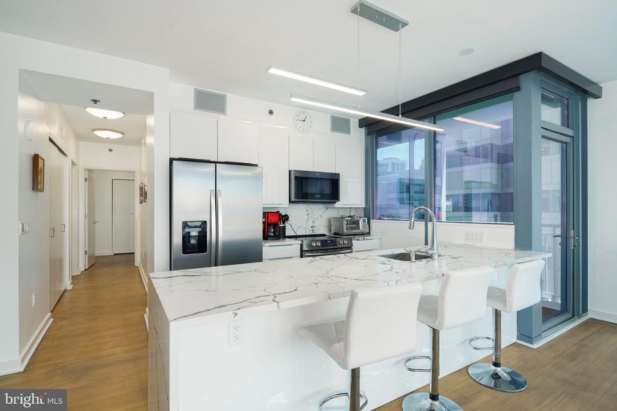 Spacious and luxurious  Murano Condominium with amazing South and East facing views of Philadelphia! This 2-bedroom, 2-bath + Den 1635 sqft residence features modern and luxurious finishes including granite countertops, wood floors, stainless steel appliances, 9-foot ceilings with floor to ceiling windows. The price includes a reserved parking space in the attached covered garage, and a storage locker. The building features a 24HR Concierge, fitness center, a heated 60FT lap pool, renovated sundeck/community room and much, much more! The building is situated conveniently next door to Trader Joes and Wine & Spirits - and is just walking distance from Philadelphia's top-rated restaurants. Spend the day shopping in Rittenhouse, or enjoying the sights at Boathouse Row, you can't beat the location and attractions located right near the Murano! - 2nd parking spot option