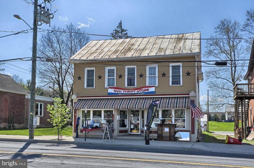 INVESTOR ALERT!!  This property is rented until 12/31/2022.  The current tenant, since 2017, is a 501(c)(3) non profit organization that would love to stay at this location.  They use the entire property and help with the maintenance.  The main level is currently used as a thrift store. It has great road frontage, 2 office areas, bathroom, dressing room, storage areas and front and rear access.  The second level has its own access from a front and rear staircase.  The second level features a kitchen, bathroom, living area, laundry area, and 3 bedrooms.  Pull down attic space provides storage and houses the HVAC for the second floor. The HVAC for the main floor is outside.  Replacement windows, house wrap under the insulation, two 100 amp panel boxes, Borough inspections are every 3 years.  To the rear of the property is a storage unit with electric.  Off street parking for approximately 6-8 cars behind the building and on street parking in front. Please be aware there are cameras on the property.