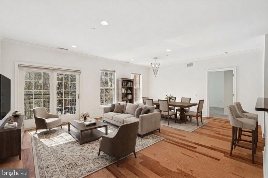 Boasting over 1,250 square feet, this pristine two bedroom, two bath residence with PARKING and STORAGE at NAVAL SQUARE features a multitude of upgrades and is not to be missed! Enter into a spacious open floor plan with high ceilings, brand new hardwood flooring, and sliding glass doors leading to a Juliet balcony. The well-appointed granite kitchen features an island breakfast bar, stainless steel appliances, and a pantry, flowing seamlessly into the bright living and dining areas—ideal for both everyday living and entertaining. The desirable split bedroom floor plan ensures privacy for each bedroom. The generously sized primary suite features brand new carpeting, a walk-in closet with custom built-ins, and an en-suite bathroom with a soaking tub, separate glass-enclosed shower, double vanity, and linen storage. The second bedroom is equally versatile and includes a tasteful Murphy bed along with custom closet organization. A full hall bathroom and a convenient side-by-side laundry closet complete this immaculate residence. Amenities of Naval Square include 24- hour security, a state-of-the-art fitness center, seasonal outdoor pool, sundeck, common room, manicured gardens, picnic areas, and guest parking. Situated on a lush 20 acre park-like setting, this pet-friendly residence is just a short distance to fine dining, one-of-a-kind shopping, and world-renowned cultural destinations. DREXEL, CHOP, PENN, University City, Schuylkill River Trail, and Rittenhouse Square are all a short walk away.