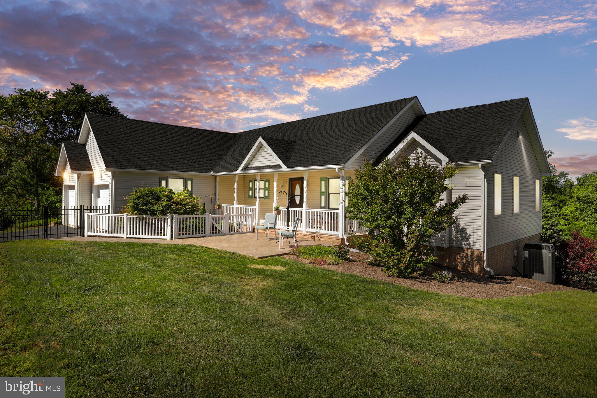 Country Living at its best, but still close to shopping, schools, banks & commuting! This home offers 3 bedrooms, 3 full baths, large open living area on main level, including main level laundry. Beautiful front porch, Rear Trex deck and a lower-level patio with a hot tub! For storage there is a 2-car garage, storage shed that is wired with lights and outlets and several storage areas in the lower level. French Doors that lead out to Deck and lower level Patio. There is a small fenced area on the side of the home for a vegetable garden. Front and side areas to the right are fenced. This property sits at the end of a cul de sac on 2.01 acres, beautifully landscaped and well-maintained with backing to trees for privacy. The Primary Bedroom/Bath features a walk-in closet with custom shelves for great organization. Soaking jetted tub, Separate Shower& Dual sinks. There is an above ground pool for those hot summer days with a large deck for relaxing. The current owners have done all the work for you including recent well chlorination, septic pumping less than a year ago, Roof replaced almost 3 years ago and the heat pump is only 9 years old! Xfinity and Frontier Fiber is available in Tabler Estates. The owners pride certainly shows in this home. It is move in ready, so you can sit back and enjoy country life living with the beauty of the wildlife and scenery.