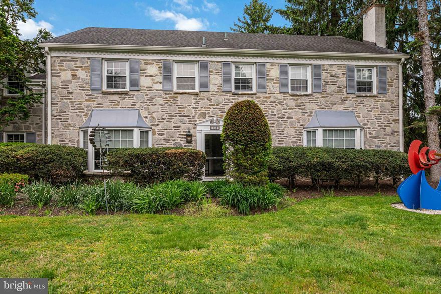 Welcome to this spacious and sun-filled Center Hall Colonial offering 5 bedrooms, 4 full baths, and 2 half baths in Wyncote. Thoughtfully designed with generous room sizes, abundant storage, and flexible living spaces throughout, this exceptional home combines timeless character with everyday functionality. From the slate foyer entry and hardwood flooring to the beautifully finished basement and expansive rear yard, every space is designed for comfortable living and entertaining. A rare opportunity to own a spacious home with incredible versatility, private driveway, and plenty of yard space.
This well-maintained home features a private driveway, 2-car garage with garage door opener, hardwood floors, and a slate foyer entry. The living room includes a beautiful bay window and gas fireplace and opens directly into the inviting family room featuring a full wall of custom built-ins and sliding glass doors leading to the expansive rear yard with plenty of space to relax, entertain, or garden.
The formal dining room showcases parquet wood flooring and another bay window. The oversized kitchen offers an abundance of cabinetry, desk area, wall oven, gas range with additional oven, and garden window overlooking the yard. Convenient laundry/mud room includes washer, dryer, laundry tub, excellent storage, laundry chute, and exterior access to the large rear yard complete with patio and shed.
The second floor offers generously sized bedrooms with large closets, including a spacious primary suite with hardwood flooring, two customized closets, dressing area with sink, and large private bath. The hall bath features double sinks. A third bedroom includes built-ins and private bath access. Additional office/exercise room and separate office over the garage with closet provide flexible space that could easily serve as an additional bedroom. The 5th bedroom over the garage has access to a full bath. Pull-down attic stairs lead to floored attic storage. The fully finished basement adds even more living space and includes a half bath plus extensive storage and closet space.