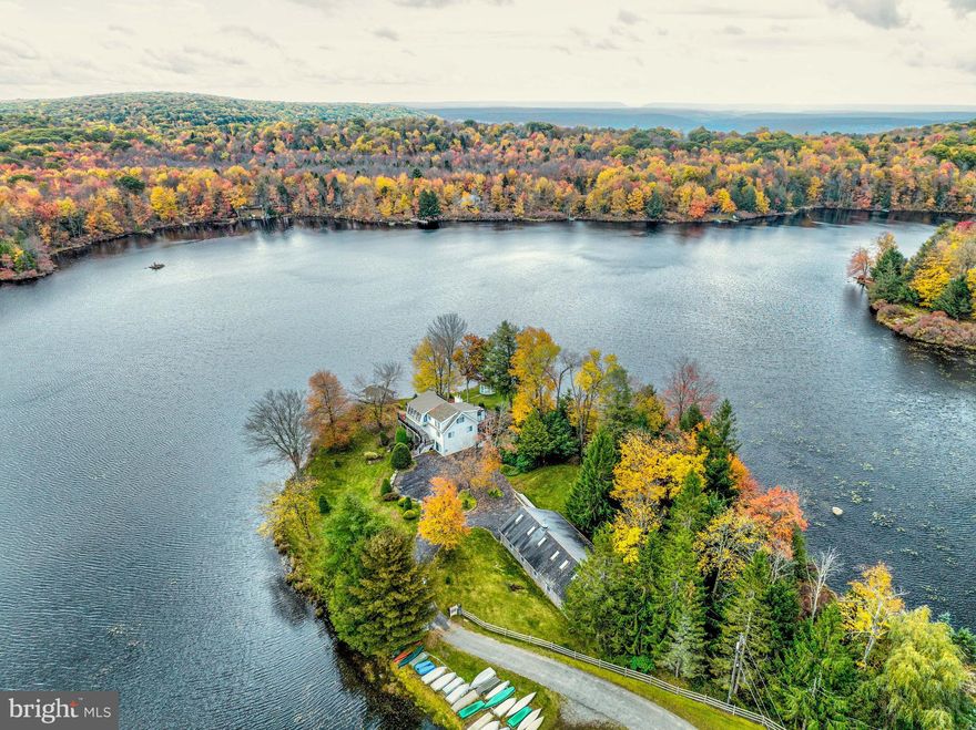 Welcome to 105 Buckhorn, where luxury meets tranquility on your very own private peninsula. This stunning three-story oasis offers over 700 feet of serene lake frontage, complete with a private covered dock, Amish Gazebo, and outdoor BBQ area, perfect for entertaining or simply soaking in the picturesque surroundings. Step inside this meticulously crafted lake-front home to discover three floors of spacious living, all above ground. Featuring a grand primary suite, complete with a private glass sunroom offering breathtaking views of the lake. With three additional bedrooms and two more baths, there's plenty of room for family and guests to unwind in comfort. Throughout the home, real cedar wood paneling adds warmth and character, creating a cozy ambiance that invites relaxation.
Experience the ultimate in peace and serenity as you gaze out from every floor, taking in the tranquil beauty of the lake and surrounding grounds. Two stone fireplaces offer cozy warmth on cooler evenings, while a loft area reminiscent of a ship made of glass provides a unique retreat for quiet reflection or intimate gatherings.
Outside, expansive decks extend the living space outdoors, providing the perfect spot to savor your morning coffee or enjoy al fresco dining with loved ones. The property also features an enormous 6+ car detached garage with a finished and insulated second floor, offering endless possibilities for use as a studio, gym, or play area.
With its unparalleled views, luxurious amenities, and unmatched tranquility, 105 Buckhorn offers a rare opportunity to live the lakefront lifestyle of your dreams. Don't miss your chance to make this extraordinary property your own.