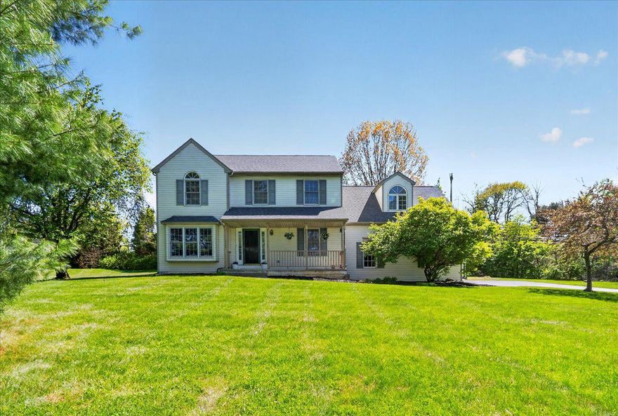 Welcome to 68 Lauren Lane! This home offers space in all the right ways. Set on just over an acre of land, this 4-bedroom, 2 full, 2 half-bath residence brings together comfort, flexibility, and a sense of ease that's hard to miss. From the moment you arrive, the long driveway and welcoming front porch (most perfect for a pair of rocking chairs) set a relaxed, unhurried tone for what's inside.

Step through the front door and you're greeted with rooms that simply breathe. A bright, traditional living room with oversized windows draws in natural light and offers the charming potential for a true window seat moment. The kitchen sits at the center of it all--open, functional, and anchored by a peninsula with seating that naturally gathers people together. Just beyond, the step-down family room adds a sense of separation, featuring distinctive half-arch windows and sliding doors that open to a wooden deck, effortlessly extending the living space outdoors. Completing the first floor is a formal dining room that soaks up the afternoon sun with views of the side yard. Prefer a different use? These spaces offer the flexibility to reimagine a home office, playroom, or creative studio. A mudroom/laundry area connects directly to the two-car garage, keeping everyday comings and goings simple and practical. Fresh paint and and newly installed main-floor carpeting runs throughout, adding warmth where it's needed most.

Upstairs, all four bedrooms offer comfortable, well-proportioned spaces, especially the oversized room above the garage, ready to adapt to whatever you need it to be. The primary suite features a walk-in closet and private bath, creating an easy, comfortable place to reset at the end of the day.

The finished basement adds even more flexibility, with multiple distinct areas already carved out for hobbies, movie nights, and/or guest overflow. Plus, a practical kitchenette and additional half bath add a layer of convenience.

Outside, the property offers open space, mature trees, and just enough natural privacy to feel tucked away. The side and backyard provide room to play, garden, or simply enjoy the outdoors.

With freshly painted walls throughout the entire house (2026), new main-floor carpeting (2026), a brand new roof (2026), and updated heating and A/C (2022), 68 Lauren Lane is a home that feels easy to live in... and even easier to grow into.