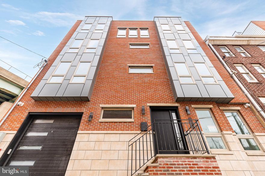 Welcome to 106 Pollard Street, a 38-foot-wide new construction home in the heart of Northern Liberties offering over 3,100 square feet of thoughtfully designed living space. With 3 bedrooms, 4 full baths, 2 powder rooms, a finished basement, an designated office space and a one-car garage, this home offers the size and layout buyers rarely find at this price point.

Step inside to wide-plank hardwood floors and an open, airy layout built for both everyday living and entertaining. The kitchen is the centerpiece of the home, featuring a large waterfall island, clean modern finishes, and plenty of space to host without feeling crowded.

The full-floor primary suite provides a true retreat, complete with a spacious layout and a spa-like bathroom featuring a freestanding soaking tub, dual vanities, and a separate water closet.

Upstairs, you’ll find two additional well-sized bedrooms, while the main level offers a flexible room that works perfectly as a home office or guest space.

The finished basement, complete with a full bathroom, adds even more versatility — ideal for a second living area, gym, or extended guest setup.

Head up to your private rooftop deck with a wet bar and take in sweeping city views — an ideal space for relaxing or entertaining.

Additional features include an attached one-car garage, tankless water heater, dual HVAC systems, generous storage throughout, a 10-year tax abatement, and a 1-year builder warranty.

Located in Northern Liberties, you’re just steps from The Piazza, Liberty Lands Park, and The Fillmore Philadelphia, with easy access to neighborhood favorites like Yards Brewing Company and Frankford Hall. Enjoy one of the city’s most walkable neighborhoods with top dining, coffee shops, and nightlife right outside your door.

With its rare width, functional layout, and prime location, this home delivers exceptional value in one of Philadelphia’s most sought-after neighborhoods.