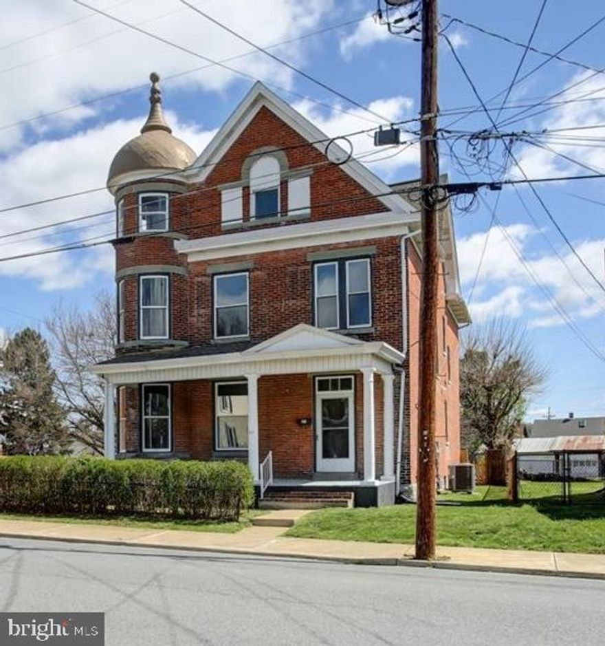 Seller has meticulously taken the time to update and preserve the original features of this Grand Ole Home! With just the right mix of modern updates and  restoration, this one is bound to please! It offers generous room sizes on the first and second floors and  a full spacious attic for possible future expansion should one need more finished space. They just don't make them like this anymore! All brick exterior, hardwood floors throughout, pocket doors, high ceilings, ornate tile fireplace (decorative), 2 claw foot tubs,  the turret, open staircase,  the list goes on. It has 4 Bedrooms and 2 full baths, So much to offer with partially updated kitchen and baths, New HVAC (electric with oil back-up), mostly all new windows, updated electric including new wiring, new 200 amp panel in basement and a 100 amp panel added in attic, new hot water heater, new lighting and many of the fixtures are new, and freshly refinished hardwood floors,. It has  front and side covered porches, and a balcony on the second floor. If you like older homes you really have to step inside to appreciate all its unique features and all its charm. It includes an extra lot, tax ID 26-5C15-028-000000, which provides a nice open side yard and includes a shed. 
Location lends itself to local parks and amenities in town. OPEN HOUSE 4/12/25 CANCELLED! OFFER DEADLINE 7PM 4/12/25.