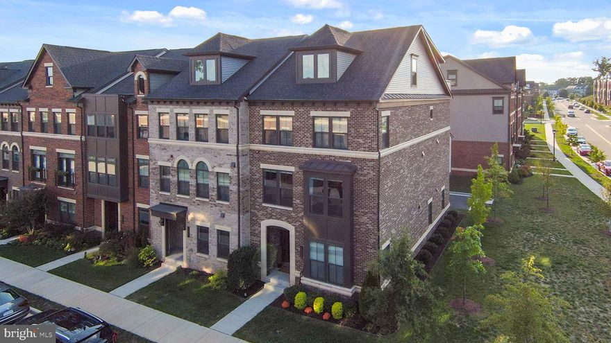 Welcome Home to 22255 Cornerstone Crossing Terrace!  This stunning end unit townhome includes over 3700 square feet of living space on four levels, five bedrooms, four full and one half bathrooms, an oversized two car garage, a rooftop terrace, and large covered balcony.  It is less than a half mile to the Ashburn Metro station, approximately six miles or a 10 minute drive to Dulles Airport, 15 minutes to One Loudoun, and just three miles from the Washington and Old Dominion Trail.  

Enter the home through the front foyer or the oversized 2 car garage. The garage is wired for an electric car charger and includes a 240V smart garage heater.  The garage door is wi-fi enabled and has been insulated. There is plenty of space for you to set up a gym, park two cars, and  store your tools!  The ground level offers a large on-suite bedroom with a full bath, perfect for an in-law or au pair suite!  

As you ascend to the levels above, you’ll notice all staircases are hardwood. The second level covered balcony has a gas line run to it for a gas fire pit or grilling. There are automatic solar shades that reduce the direct sunlight and heat. The open floor plan connects the living, dining, and kitchen space which is perfect for entertaining. The living room is hardwired for a premium surround sound system and additional lighting. It also has electric black-out shades that are set to automatically close daily at 4pm (schedule as you please!). The kitchen boasts built-in cabinetry which includes under cabinet lighting, an upgraded Bosch dishwasher, a wall oven, a built-in microwave, gas cooktop, and a walk-in pantry with floor-to ceiling shelving. 

The third level is home to the primary suite that gives prominence to two oversized large walk-in closets, a beautiful bathroom with a roman shower with double shower heads and frameless glass shower door. Also on this level, you will find the laundry room, a second full bathroom and two additional bedrooms.

The fourth floor loft features a fifth bedroom, also known as the Harry Potter room, the fourth full bathroom, and rooftop terrace. The main space in the loft is currently set up as a combination whiskey bar and gaming room, but can be used as a library, office, or playspace. 

This home is a smart home, with Google technology that includes a ring doorbell camera and 2 external mounted security cameras and two nest thermostats with dual HVAC systems for comfortable temperatures throughout. There are conduits running from the maintenance closet on the first floor to the second and fourth floors with direct wiring to the Unify router. Two Unify wi-fi extender pucks are mounted on the second and fourth level for full high speed internet coverage throughout. 

The Westmoore Community is more than just a place to live, it's a place to call home. With annual holiday events and regular neighborhood gatherings, it offers residents extensive spaces to enjoy the outdoors, a community center with a resort style pool, clubhouse with a caterer’s kitchen for hosting family events in the great room, a 24-hour fitness center, two community parks with tot lots and a dog park area, an Amphitheater for summer concerts, trails and MORE!