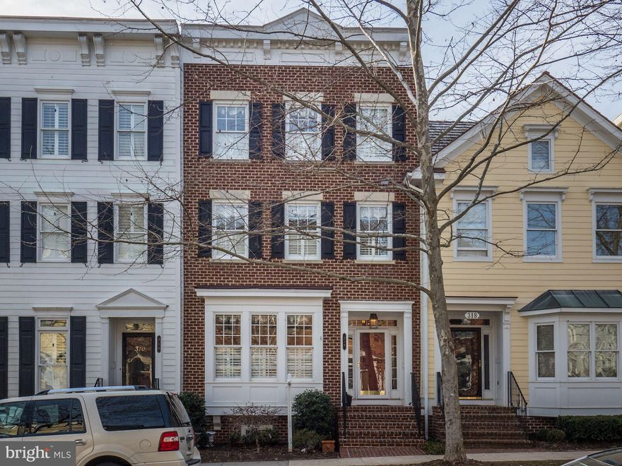 Offers, if any, due Mon 3/18 by 5pm. Jaw-dropping 4-bed 4.5-bath townhouse in sought-after Kentlands neighborhood. Stunning design features include archways, crown/chair molding, and gleaming hardwood floors throughout main and lower levels. Sunny, spacious kitchen boasts ample cabinet space, large island, sparkling granite, and all stainless-steel appliances, plus bonus built-in bar. Dual master bedrooms both with ensuite spa-like master baths. Top floor boasts additional sitting room and access to rooftop deck! Other luxuries include basement fireplace and balcony overlooking lower patio. 2-car garage. Unbeatable location with easy access to pool, tennis courts, walking paths, lakes, and Kentlands Market Square.