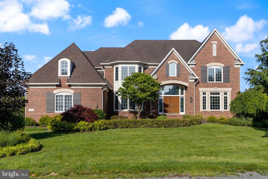 Experience refined living in this spectacular Gulick luxury home, nestled on a.77-acre lot backing to trees and a little creek. Boasting over 7,300 square feet of elegant living space, this stunning residence features 6 spacious bedrooms, with 5 located on the upper level, along with 5.5 bathrooms.
From the moment you arrive, the stately curb appeal and expansive 3-car garage set the tone for the level of quality found throughout the home. Inside, a grand staircase and open floor plan is complemented by soaring ceilings, lovely architectural details, and beautiful hardwood floors on each level. The gourmet kitchen offers stainless appliances, quartz counters and generous prep space—ideal for entertaining or everyday living.
The upper-level primary suite is a true retreat, complete with a sitting area with wonderful views, expansive bathroom and dual walk-in closets. Each secondary bedroom includes its own en-suite bath. or buddy bath, offering privacy and convenience for family or guests. Additional highlights include formal living and dining rooms, a main level office or study, sunroom overlooking the backyard, a spacious finished lower level with multiple entertaining areas including a custom wet bar, movie room with tiered seating, gorgeous stone fireplace, walnut wine storage closet and abundant natural light throughout.
Step outside to enjoy the beautiful landscaping & hardscaping and the expansive flat yard  - perfect for outdoor entertaining, play, or a future pool.
This extraordinary home offers the perfect blend of luxury, space, and function and location - just minutes from the Ashburn Metro station, shopping & restaurants. Ashburn Farm’s fantastic amenities include 3 pools, tennis / pickleball courts, basketball courts, playgrounds and trails & ponds.  It’s an amazing place to live!