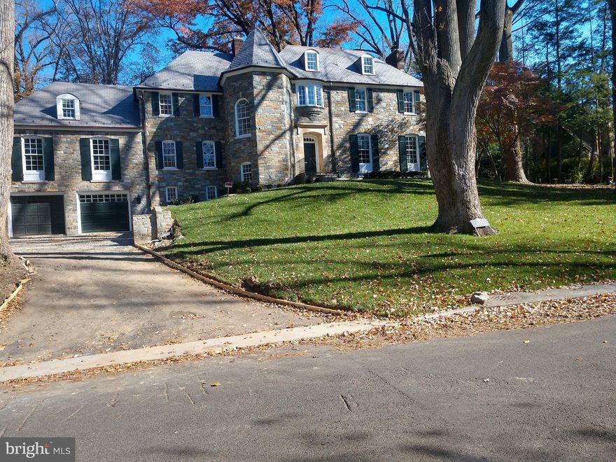 HANDSOME TUDOR INFLUENCED HOME TOTALLY RENOVATED WITH  NEW ROOF, COOPER GUTTERS, 4 NEW ZONES OF HVAC, NEW PLUMBING, NEW WINDOWS, 10 FOOT CEILINGS ON 1ST FLOOR,  9 FOOT CEILINGS ON LOWER LEVEL,  2 STAIRWAYS BETWEEN LL AND MAIN LEVEL, 7 BEDROOMS, 8 FULL BATHROOMS, 2 HALF BATHROOMS, OVERSIZED 2-CAR GARAGE, STUNNING KITCHEN WITH VAULTED CEILINGS, CUSTOM CABINETRY, MARBLE COUNTERS, ITALIAN GAS COMMERCIAL STOVE, SEPARATE WET BAR WITH WINE CHILLER AND REFRIGERATOR, NEW WHITE OAK FLOORING, WAXED BRASS HARDWARE THROUGHOUT,  LOWER LEVEL AND BEDROOM LEVEL LAUNDRY, SPACIOUS LOWER LEVEL WITH EXERCISE ROOM, BEDROOM, 2ND FAMILY ROOM - ALL WITH PORCELAIN TILE FLOORS,