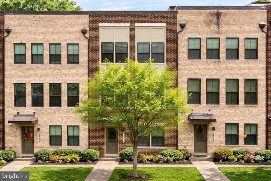Welcome to 2804 Lewis Avenue, an exceptional residence perfectly positioned within the highly sought-after Village of Towne Square community — where modern comfort, thoughtful design, and everyday convenience come together seamlessly. Built in 2019 and freshly refreshed with brand-new paint and carpeting, this beautifully maintained brick-front townhome immediately impresses with its contemporary portico entry and welcoming curb appeal, complemented by ample guest and street parking for effortless entertaining. Step inside to sun-filled interiors defined by a warm, natural palette and durable luxury vinyl plank flooring that flows throughout the home’s main living areas. The entry level offers remarkable flexibility, featuring a private bedroom with elegant French door entry and recessed lighting — ideal for guests, a home office, or multigenerational living — along with a spacious storage closet, coat closet, and a fully finished two-car garage with abundant storage solutions. Ascending to the heart of the home, the main living level unfolds into an inviting open-concept design crafted for both daily living and entertaining. A stunning chef’s kitchen anchors the space, showcasing stainless steel appliances, a deep stainless steel sink, designer backsplash, expansive pantry, and generous prep and gathering areas. The adjoining dining space and breakfast nook create the perfect setting for morning coffee or evening hosting, while the family room offers comfort and sophistication with crown molding, plush carpeting, and abundant natural light. A well-appointed powder room completes this level with both style and convenience. The upper living quarters provide a peaceful retreat highlighted by a luxurious primary suite designed for relaxation. Featuring custom walk-in closet built-ins and refined window treatments, the suite continues into a spa-inspired ensuite bath complete with granite double vanity, elegant stone countertops, soaking tub, and a beautifully tiled walk-in shower with built-in seating. Two additional bedrooms offer comfortable accommodations with ample closet space and natural light, serviced by a full hall bath featuring granite finishes and tiled flooring. A conveniently located upper-level laundry area enhances everyday ease and functionality. Beyond the home itself, residents of the Village of Towne Square enjoy a vibrant, connected lifestyle in one of Suitland’s most convenient locations. The community offers beautifully maintained common areas and walkable surroundings while placing you minutes from major commuter routes, Joint Base Andrews, and downtown Washington, D.C. Nearby shopping, dining, and entertainment options include Towne Square at Suitland, National Harbor, and an array of local restaurants, retail centers, and parks. Easy Metro access makes commuting effortless, blending suburban comfort with unmatched urban accessibility. This is more than a home — it is a turnkey opportunity to experience modern living, thoughtful design, and prime location all in one exceptional offering.