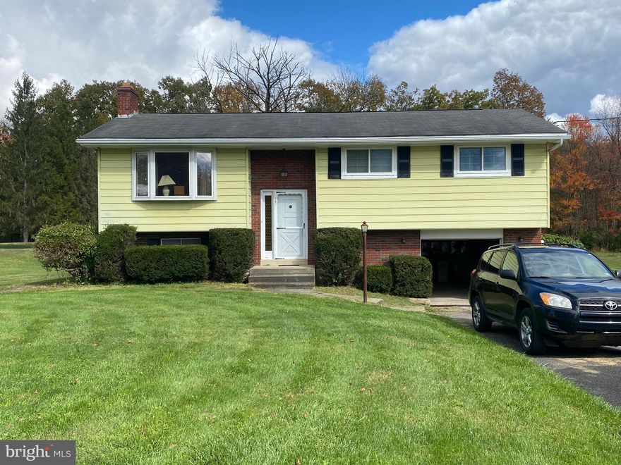 Charming Countryside Bi-level looking for a new owner. The park-like back yard is endlessly peaceful creating a seamless transition between home and nature, surround yourself in tranquility. The flagstone foyer and solid wood door create a welcoming entry. Sizable living room with big bay window that allows the bright natural sun light bathe you in to vitamin D. Spacious kitchen with plenty of counter space to prepare the messiest meals and more than enough cabinet space to hold all your ingredients! Classic hardwood floors throughout add to either your contemporary flair or traditional decor. The basement is ready and waiting for an upgrade, just bring your personality and tools to create more living space. The built-in one car garage completes this beauty!! Don't miss out!!