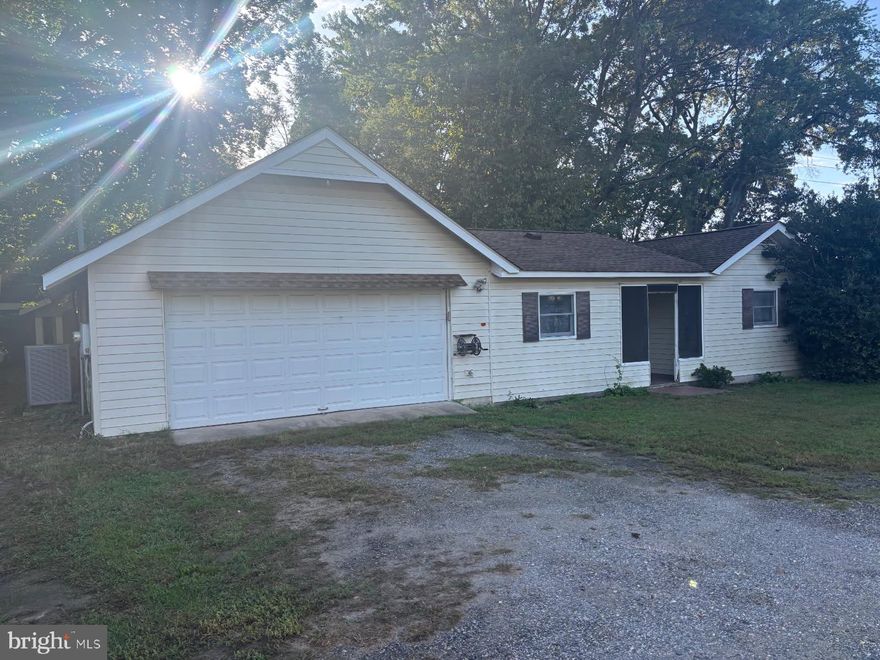 Home to the left on driveway private shared yard and pier.  Dockage for one boat! Small 2 bedroom 1 bath cottage with Garage.  Privacy and Quiet.  New carpet, freshly painted,  washer and dryer on order.