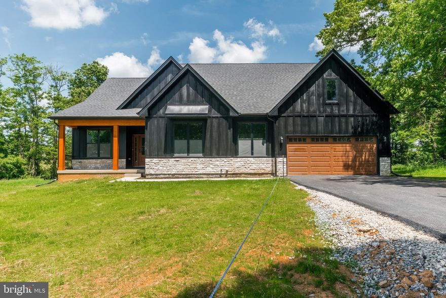 Tucked away in Shepherdstown and ready to occupy. 2 +/- acres situated in a tranquil setting. Amazing location for this 4 bedroom 2.5 bath farmhouse style home. Quality construction nicely upgraded with stainless steel kitchen appliance package, granite, luxury vinyl plank flooring, upgraded cabinets, vaulted ceilings & more. Full unfinished basement. Close to amenities in a private country setting. Builder has tastefully selected all the finishes for you with all luxury vinyl plank flooring and granite. Front Load garage as shown with upgrades. Pictures are of similar finishes and . Completion expected for May 20th 2024. Driveway paved, gas range upgrade and many more options are added. Great location and close to all the amenities of Shepherdstown, the Potomac River and Shepherd University.