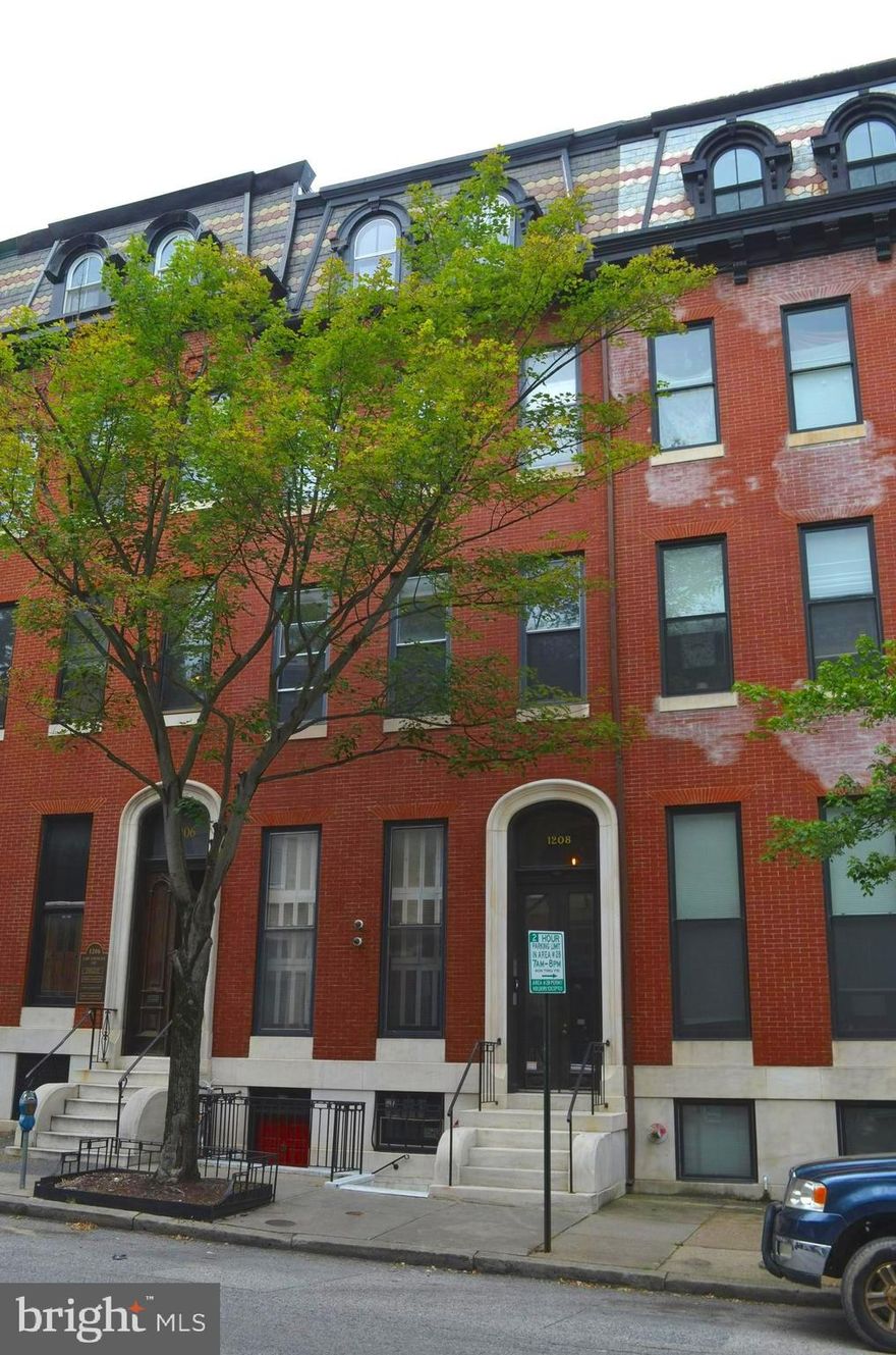 FULLY LEASED Stunning luxury apartment building Located on a tranquil tree-lined block of Victorian homes, this stunning, brick, fully-renovated (2014) and fully leased 8,600 total sq ft luxury apartment building has exceptional character and design! TAX BILL ONLY $10,800 with special credit thru 6/26.  Building has four two-bedroom apartments with garage, roof-top terrace and bonus lower level in desirable, historic Mount Vernon. The lower-level space (currently used as private gym for tenants) could be converted to add-value as fifth unit or commercial space.  Each luxury 2 bdr unit has been masterfully designed and well-appointed with a chef's kitchen, granite counter-tops, beautiful hardwood floors, carved moldings, Carrera marble bathrooms, and priceless historical charm! Each unit is separately metered for gas/electric and has its own individually controlled central heat/AC, in-unit laundry, and security systems. The building is modernized, up-to-code, and has top of the line security and sprinkler systems.
Located in Historic Mount Vernon & Baltimore’s Central Business District, the building has convenient access to restaurants, shopping, hotels, banks, hospitals, parks and Penn Station. Baltimore’s Penn Station is almost finished with huge upgrades which will allow for more Amtrak Acela high-speed lines to more efficiently connect to Washington D.C., Philadelphia, and New York City.  Nearby neighbors include Baltimore School for the Arts, Peabody Institute, Johns Hopkins University, Walters Art Gallery, Center Stage, Engineer’s Club, Mount Vernon Club and The University of Baltimore.
Tenants wanting convenience will realize the superb location of this gorgeous property located between Biddle and East Preston -a five-minute walk to Penn Station, four-minute walk to the John Hopkins Shuttle, and minutes to the I-83 exits.
Unit A is simply a work of art! Two-level, 2 bdr/2 ½ baths, 13’ ceiling 2300 sq ft of luxury living, and….a garage! A perfect mix of modern living with the historic touches preserved. The main living area has a sculpted fireplace as a centerpiece; Top-of-the-line Jenn-air appliances adorn the over-sized gourmet granite kitchen island creating an absolutely beautiful space to live and entertain. 
Units B & C are both 1584 sq ft and have 2 bedrooms, 2 bath/2 ½ baths respectively with contemporary updated chefs kitchens, beautiful fireplaces, Carrera marble spa-like luxurious baths, own washer-dryer and beautifully preserved hardwood floors. 
The private, rooftop terrace belongs to the penthouse unit D. This 2 bedroom, 2 bath home has the same updated kitchen and baths while keeping the original historic charm. With 9’ ceilings the 1240 sq ft home also has its own washer/dryer, dishwasher, granite countertops and updated appliances. A unique design feature is the brick wall as you walk to the bedrooms from living area. The rooftop deck is the key element to this unit – tenants enjoy the stunning views and tranquility. 
Incredible investment opportunity to own this fully-leased impeccably renovated building in Mount Vernon. Adorned with stained glass, ceiling skylight and terrace garden – this is a truly one-of-a-kind beauty! With the ability to add value by converting lower level gym space to another unit or manage unit yourself this turn-key opportunity is unique. Please allow plenty of time for showings to be respectful and considerate to tenants; List agent must accompany prospective new owners on showing tour.