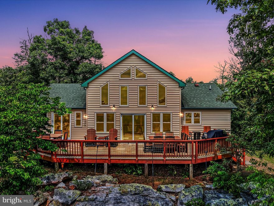 TWO PROPERTIES IN ONE DEAL! STUNNING!!  BEAUTIFUL VIEWS!!  This amazing, well maintained cedar home on 16+ acres includes not just one, but two fully furnished, move-in ready properties- offering everything you could want in a peaceful mountain retreat and more!! The 2 bedrooms and 2 bathrooms on the main floor make it ideal for one level living while the spacious loft is currently used as a third bedroom. Feel the stress melt away as soon as you enter the foyer and are welcomed with large windows that span across the rear of this home with breath taking views for miles.  Enjoy every season from your open family room where glass doors invite you outside to a large deck that has plenty of space for a hot tub/spa to relax in while overlooking the valley and distant mountains. A beautiful wood stove makes it cozy during those fall evenings. Imagine the fall colors. Relax on your deck and enjoy watching wildlife stroll through the woods.  Sit at the fire pit and surround yourself with tranquility and peacefulness while star gazing at night and listening to the gentle whispers of wind flowing through the mountain top. Venture to the upper loft and admire the spectacular views that can be a third bedroom, home office or even an exercise room. It's a great space to meditate or just relax with family and friends. A lighted pathway leads to the Guest House which creates an incredible ambiance for your evening guests and family. The Guest House boasts a large two car garage and sits on 5 acres. The upper level has been newly renovated with a full kitchen, family/dining room, 1bedroom and 1 bath.  This Main Home and Guest House can be a perfect full-time residence, weekend getaway, or Airbnb! Come visit this private oasis and make it your own. This is a MUST-SEE HOME- in person!!
Located just 2.5 hours from Northern Virginia, DC, or Baltimore. (40 min. from Berkeley Springs, WV.) (50 min. from Winchester, VA.) (1.2 hrs. from Hagerstown, MD.)