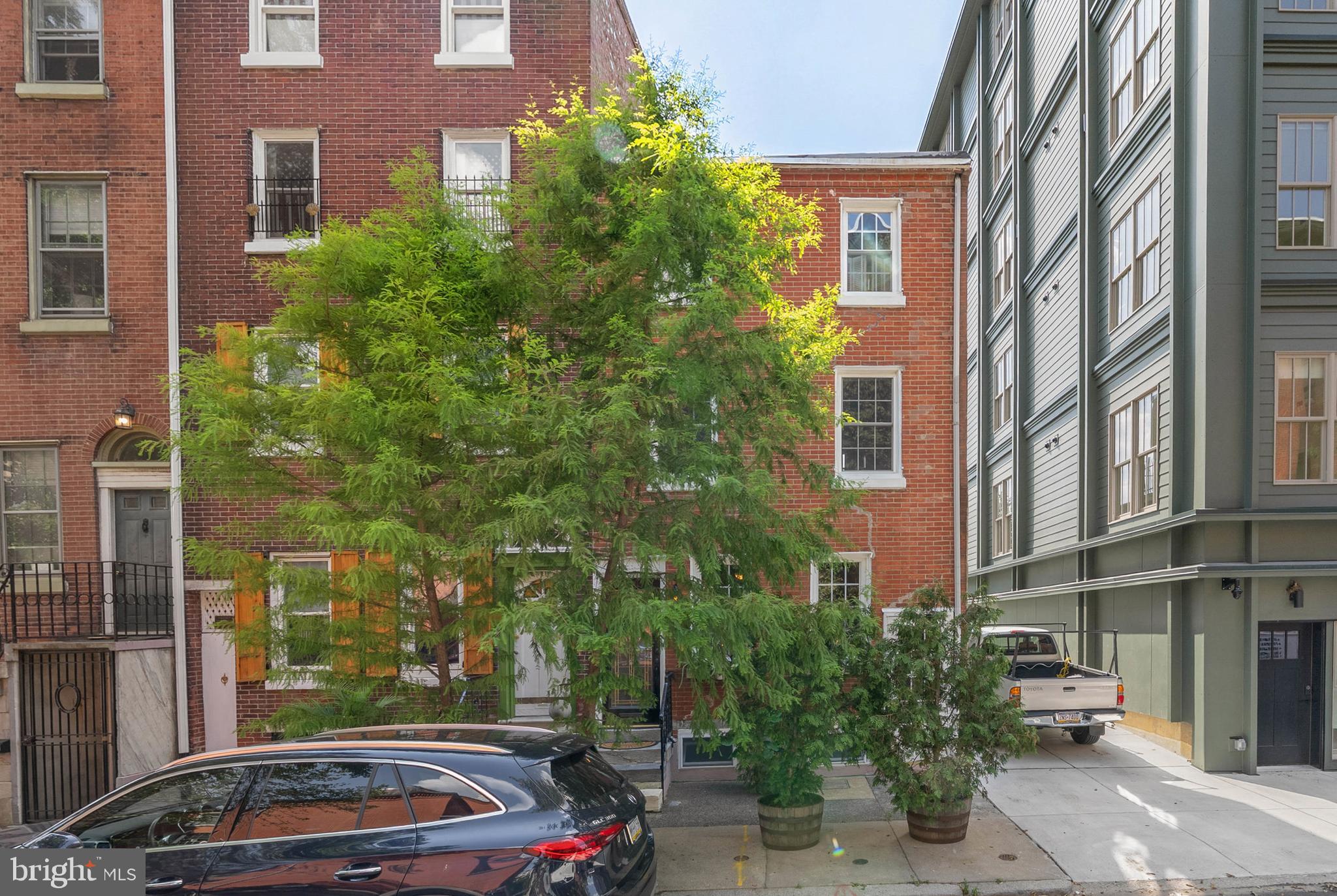 Hidden away in a quiet section of Old City, 254 N Lawrence Street is a historic gem that has been meticulously restored while adding updates for modern living. This 130+/- year old home has 4 bedrooms, 2.5 bathrooms, and amazing outdoor spaces off of each level. A quiet, tree-lined block leads to the towering brick facade. Inside, the living room has distinctive character showcased in the original, random-width hardwood floors, exposed beam ceilings, wood shutters, and fireplace mantel. Past the staircase, you'll find a bright, open dining room and an updated kitchen with custom cabinetry, stainless steel appliances, including a dishwasher, and granite counters. A powder room is nearby. One of the home's highlights is surely the large, sunlit den at the rear of the first level. This airy space is lined with glass doors that allow seamless indoor/outdoor entertaining with the home's rare backyard, perfect for summer barbecues and al fresco dining. Up on the second level, a bright bedroom with features similar to the living room is at the front. At the rear is a second bedroom and a full bathroom with the laundry. Two more bedrooms and a large bathroom top off the home. Each level has its own roof deck that displays mesmerizing views. There's also an expansive basement with extra storage space and updated utilities. In addition to everything inside, 254 N Lawrence St's sought-after location earns a Walk Score of 96! This prime Old City location is steps from friendly shops and top-rated restaurants, like Radicchio Cafe and Kisso Sushi Bar. The nation's history is on display nearby at Independence Mall, and lively events are held along the Delaware Riverfront at Penn's Landing, Cherry Street Pier, and Spruce Street Harbor. Plus, there's easy access to public transit, I-676, I-95, and South Jersey. Schedule your tour today!"
