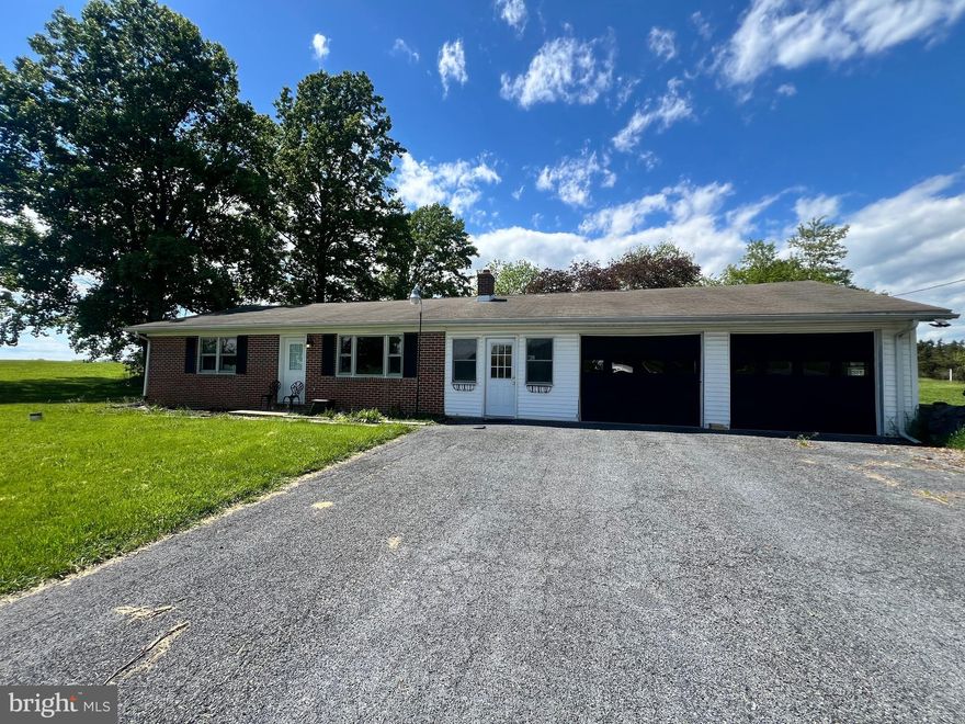 Welcome home to this brick rancher nestled on .65 acres in a peaceful country setting just outside Chambersburg. This 2-bedroom home offers comfortable one-level living. The spacious 10x27 breezeway is perfect for relaxing, entertaining, or creating a cozy sitting area, while the oversized 21x27 garage provides plenty of room for vehicles, storage, hobbies, or a workshop. Enjoy the beauty of country living with room to spread out, scenic surroundings, and the convenience of nearby amenities.