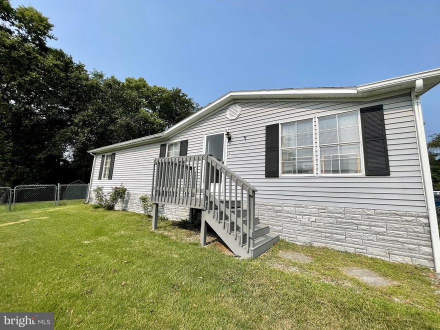 GREAT OPPORTUNITY TO OWN! 3 BDRM/2 BA manufactured home with lots of updates including new roof in 2021, new CAC in 2020 & new natural gas furnace in 2022! Spacious interior features a living room, dining area with built ins, kitchen, laundry/mudroom, 3 BDRM/2BA including owners suite with walk in closet & bathroom with large vanity. Side deck, patio, flat fenced in rear yard that backs to trees for great privacy + 2 sheds & off street parking in the driveway. Some cosmetic work needed to make home reach it's full potential. Being sold AS-IS, seller prefers cash or conventional loans.