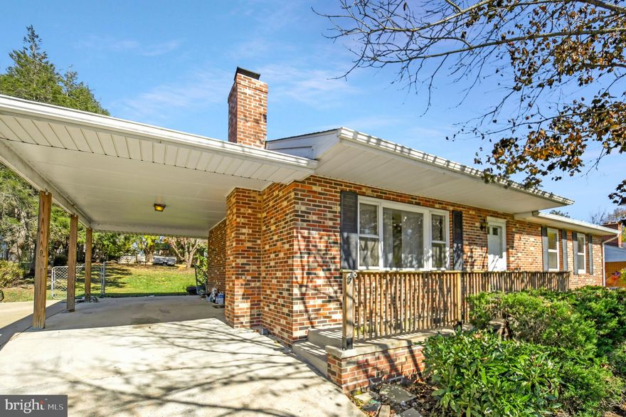 This lovely all brick ranch home is situated on a wooded lot on a quiet cul-de-sac with a large, fenced backyard & views of the mountains from the front porch! Great for entertaining, the spacious backyard includes a patio with wooden pergola and garden plantings. Plus two sheds—including an extra-large workshop/ shed complete with electricity (perfect for a workshop/man cave or a “she shed”!) The interior of the home features hardwood floors and a smart layout—with a lower walk-up level. The light-filled, eat-in kitchen features plenty of cabinetry, Stainless Steel appliances and opens to the patio—and is perfect for accessing the outdoors for entertaining large gatherings. The sunny living/family room features extra large windows and plenty of space for gathering. The main level has three bedrooms and a convenient hall full bath. On the lower level,  you'll find a great space for relaxing or playing games. All this on the lower level-- plus a full bath, extra large storage area with potential for a craft room or work-out room and a walk-up.  Close to the convenience and amenities of Brunswick, this home has easy access to a playground, shopping, a grocery and restaurants! Other features of the home include: an exterior 30 Amp RV plug, ceiling fans in all the bedrooms, a heater/exhaust in the upstairs bathroom, a hybrid heat pump/electric hot water heater, and a water softener system. Also, access to the backyard with a large gate--via an alley.