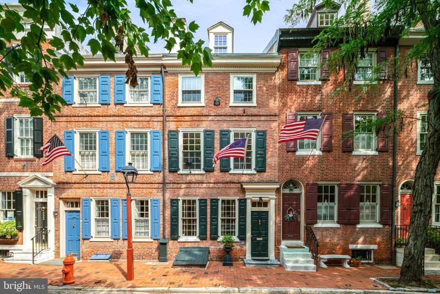 Beautifully designed historic home with PARKING ! Located on  the picturesque "street of flags" in the heart of Society Hill, this three bedroom home has been lovingly maintained by its owners and offers both exceptional inside and outside space ( wait till you see the garden and deck!). Enter the spacious living room with a gas fp, original hardwood floors, moldings and  windows viewing Delancey Street . Past the living room is a delightful atrium and powder room. The separate dining room with hardwood floors is ideal for large gatherings. The open kitchen has great cabinet space, large windows  and a door leading to the gorgeously landscaped  garden and a parking space with an electric garage door opener. On the 2nd fl are the main bedroom suite and the second bedroom. The smaller bedroom is flooded with natural light and views the garden. The large main bedroom has a fp, excellent closet space and a ceiling fan. The full bath includes a conveniently located washer/ dryer. The 3rd fl offers another large bedroom ( currently used as a den) with hardwood floors, another full bath with a linen closet, a walk-in closet  and windows emitting wonderful natural light. Above this room is an open sleeping loft/office./exercise space. Walk up stairs to a huge bonus - an awesome large deck  with fabulous views. The lower level of the home houses an office with  a stone fp and built-in bookshelves.  This level also has a separate work/ storage room and a utility room. Not only is this home extraordinary by itself it also boasts a location within easy access to city living including a variety of dining  and shops, the Ritz Cinema, Avenue of the Arts, Independence Mall and marvelous Washington Square Park. Plus it has a Walk Score of 99, Transit Score of 100 and Bike Score of 92 !