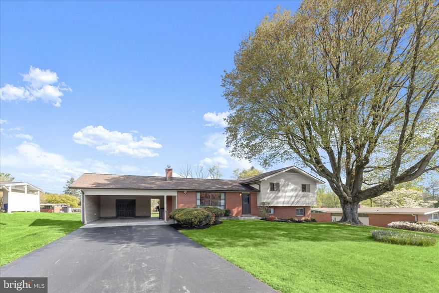 Set on a beautiful half-acre in sought-after Stevenson, this well-appointed split-level home offers a great balance of space, updates, and everyday livability, with a layout that feels both open and incredibly functional. The main level is filled with natural light, anchored by an oversized front window and impressive ceiling height, creating an airy feel that flows easily from the living room into the dining space, perfect for both casual living and entertaining. The updated kitchen is thoughtfully designed with quartz countertops, a sleek tile backsplash, 42-inch soft-close cabinetry with under-cabinet lighting, and stainless steel appliances including a double wall oven and induction cooktop. Sliding doors lead directly to the outdoor living space, making indoor-outdoor flow feel effortless.bUpstairs, the primary suite offers a quiet retreat with dual closets, a private balcony overlooking the backyard, and an updated en-suite bath with a walk-in shower. Two additional bedrooms and a full hall bath complete the upper level. The lower level adds another layer of living space with a comfortable family room featuring custom built-ins, a half bath, and a flexible bonus room that works well as a home office, guest space, or additional bedroom.  An additional finished area provides even more versatility, ideal for a media room, playroom, or home gym. Outside, the backyard offers the kind of space that is hard to find, with room to spread out, entertain, or simply relax. The partially covered patio adds flexibility for year-round use, while the two-car carport with an attached storage room with electricity adds everyday convenience. With its thoughtful updates, flexible layout, and setting in one of Stevenson’s most desirable locations, this is a home that truly makes sense the moment you walk through the door. Some images have been virtually staged.