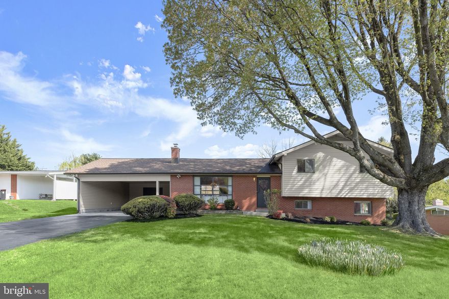 Introducing this spacious four level home tucked away on a half acre lot in the desirable Stevenson, offering three bedrooms with two and a half bathrooms. Step inside to discover an inviting front living room with an oversized window and soaring tall ceilings that continue into the dining room, large enough for hosting holidays and gatherings. The renovated kitchen boasts quartz countertops, a stylish tile backsplash, soft-close 42-inch cabinets with undermounted lighting, sliding glass doors outside, and stainless steel appliances including a double wall oven and an induction cooktop. Upstairs, the primary bedroom features two closets, a private balcony overlooking the backyard, and an en-suite bathroom with a walk-in shower. Two additional bedrooms and a hall full bathroom complete this level. Downstairs, the lower level has a large family room with built-ins, half bathroom, and a versatile den that is ideal for an office or even a potential bedroom. The basement level expands the living space with a recreation room, perfect for a game room of home theatre. A utility room includes recently-replaced laundry and ample storage with a cedar closet, with several additional closets throughout the home. Outside, enjoy the expansive backyard and a partially covered patio. The carport can accommodate two vehicles and has a storage room with electricity.