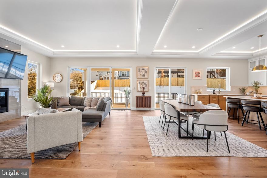 OPEN HOUSE SATURDAY 2/14 & SUNDAY 2/15, 2 PM to 4 PM.  WELCOME!  STUNNING! 

This newly completed custom home by Bella Home Construction offers over 7,600 square feet of well-planned living space in a quiet McLean location. Unlike most new construction, it includes a private elevator serving all three levels, a true main-level bedroom suite, and a layout designed for long-term flexibility and multi-generational living.

The home features 6 bedrooms, 6 full bathrooms, and 2 half baths, with wide-plank European oak flooring throughout all levels, 10-foot ceilings on the main floor, and 9-foot ceilings on the upper and lower levels. Every material and finish was selected with daily living in mind—elevated, durable, and timeless rather than purely decorative.

The main level stands out as a distinct showpiece, offering over 600 square feet of additional entertaining space—an exceptional and rarely found feature in new homes. Two separate family/living areas allow for larger gatherings, flexible furniture layouts, or elegantly formal and casual spaces. A private office includes custom built-in bookshelves and French doors. The dining area is enhanced by a butler’s pantry with sink and built-ins, along with a wood accent wall that adds warmth and definition without excess ornamentation.

The kitchen is designed for functionality, with a large central island, walk-in pantry, and direct connection to the dining and family spaces. Large sliding glass doors open to a covered porch and expansive deck, creating a natural indoor–outdoor flow. The flat, fully landscaped backyard was carefully planned to maximize natural light and support outdoor activities and everyday use.

Upstairs, the owner’s suite includes a sitting area with fireplace, spa-inspired bathroom with heated floors, a large glass-enclosed shower, soaking tub, and oversized walk-in closets. Three additional en-suite bedrooms provide privacy and comfort. The oversize laundry room is equipped with a large-capacity washer and dryer, sized for a household of this scale.

The walk-out lower level adds meaningful living space, including a private bedroom suite, large recreation room with fireplace, theater room, studio or gym, mini kitchen/bar, and a mudroom with a dog shower.

Completing the home is an oversized four-car tandem garage with EV charging capability, another feature rarely offered in new construction.

This home was thoughtfully designed to address common limitations found in many new builds—limited main-level living, lack of entertaining space, undersized garages, and layouts that fail to adapt over time.

Private tours with the builder are available by appointment. 

Conveniently located near West Falls Church Orange Line Metro and Mclean Silver Line stations with easy access to I-495, I-66, GW Parkway, Route 7, Route 123, and Dulles Toll Road. Close to Tysons Corner, Tysons Galleria, Capital One Hall, Wolf Trap, and Great Falls National Park.