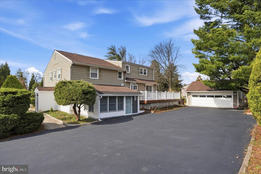 Welcome to 898 Crestline Drive, a beautifully maintained split-level single-family residence situated in the heart of Blue Bell within the desirable R-2 zoning district. Set on over half an acre of landscaped grounds, this exceptional property seamlessly combines comfortable residential living, especially for a big family with the potential for a professional office in a highly visible location along Skippack Pike, as this property used as a doctor's office previously for a long period of time.  The upper levels of the home feature four spacious bedrooms and three full bathrooms. The lower level is thoughtfully configured for professional or flexible use, offering a large office with a private side entrance, three additional office or consultation rooms, two powder rooms, and a separate stall shower. The property also includes a finished basement with laundry and storage space, as well as a detached two-car garage.  Upon entering through the main entrance on Crestline Drive, you are welcomed by a front porch and an inviting foyer that leads to gleaming hardwood floors throughout the main level. The bright and airy living room is highlighted by recessed lighting, a large bay window that fills the space with natural light, and an elegant wood-burning fireplace. The living area flows gracefully into a dining area featuring custom built-in shelving and cabinetry, which opens seamlessly to a chef’s kitchen.  The gourmet kitchen is designed for both functionality and style, boasting granite countertops, a spacious center island, decorative backsplash, neutral cabinetry, a deep sink, and stainless-steel appliances including a built-in microwave w/vent, refrigerator, new dishwasher, and electric range with oven. Sliding glass doors from the dining room lead to an expansive maintenance-free rear deck—perfect for outdoor entertaining and gatherings with family and friends during the warmer months.  The next level features newly installed luxury vinyl plank flooring throughout the hallway and bedrooms. The primary suite offers a beautifully updated private full bathroom, while two additional generously sized bedrooms share a well-appointed hall bath. Just a few steps above, you will find a fourth large bedroom complete with its own full bathroom, abundant closet space, and convenient access to the attic.  The finished basement provides additional living and entertainment space, along with a dedicated laundry area and ample storage.  Additional highlights include a detached two-car garage with automatic opener and a long & wide driveway accommodating up to eight vehicles.  Ideally located within the award-winning Wissahickon School District, this property offers convenient access to Route 202 and Germantown Pike, minutes away from Montgomery County Community College and is within walking distance of Center Square Shopping Center, as well as a variety of local restaurants, shops, and amenities.  This unique property offers exceptional flexibility, generous living space, and a prime Blue Bell location.