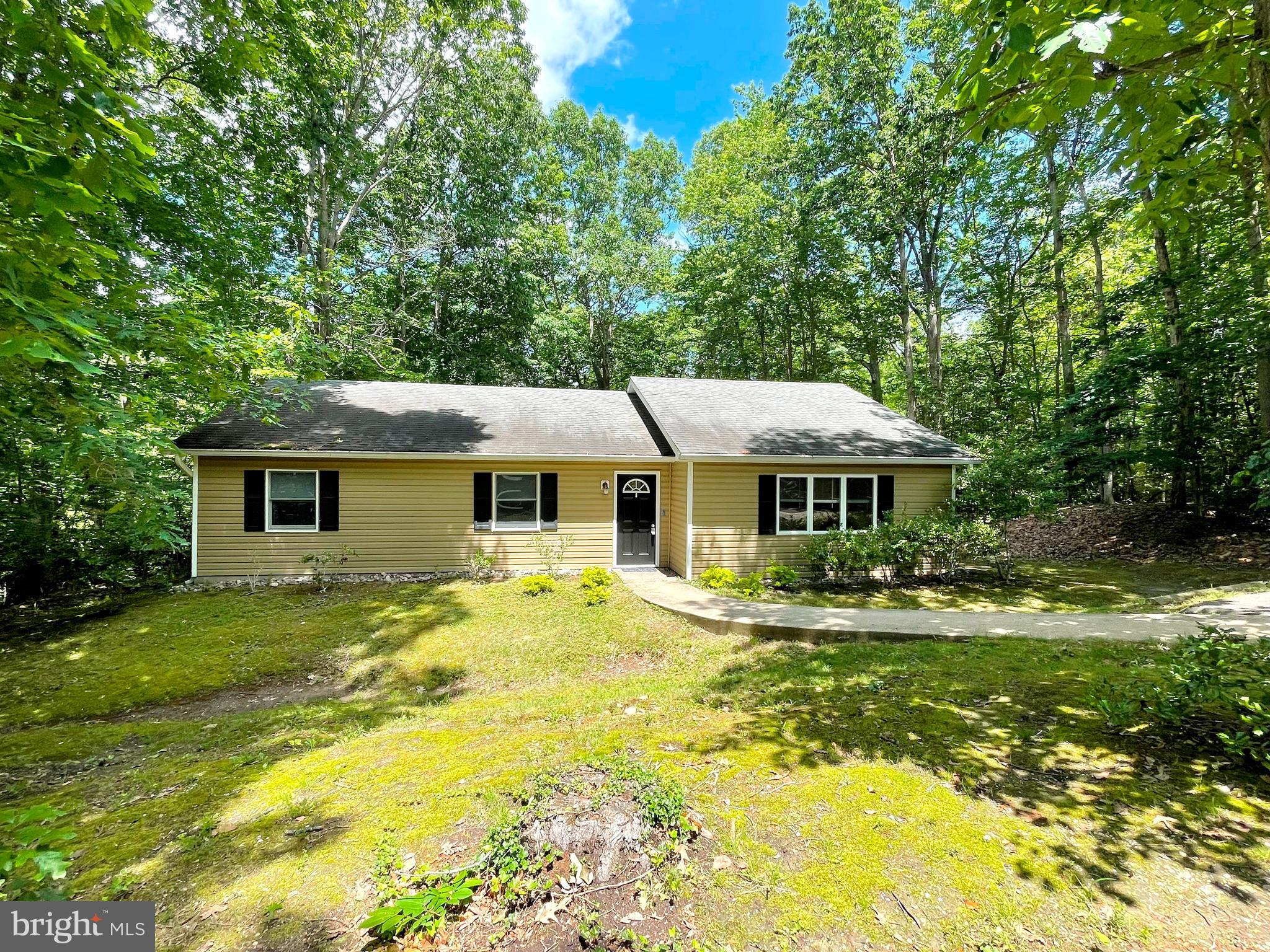 3BR 2FB Rambler with large rear deck in the fully fenced rear yard backing to wooded privacy. Spacious kitchen with granite counter tops, table space and breakfast bar. Open floor plan in the entry foyer, living room, kitchen and dining areas. Living room, dining and kitchen areas offer luxury vinyl plank flooring and vaulted ceilings. Spacious Primary bedroom with Primary bath and walk-in closet with closet organizer. Paved driveway with parking area. Community offers two private community beaches on the Chesapeake Bay, equestrian riding stables, horseshoe pits, freshwater lakes, playgrounds, campgrounds and even a private airport. The home is located very close to the Rousby Hall Road entrance into Chesapeake Ranch Estates allowing quick and easy access to Routes 2/4 for a quick drive to Lusby, Solomons Island, California/Lexington Park, PAX NAS, Calvert Cliffs and points beyond.