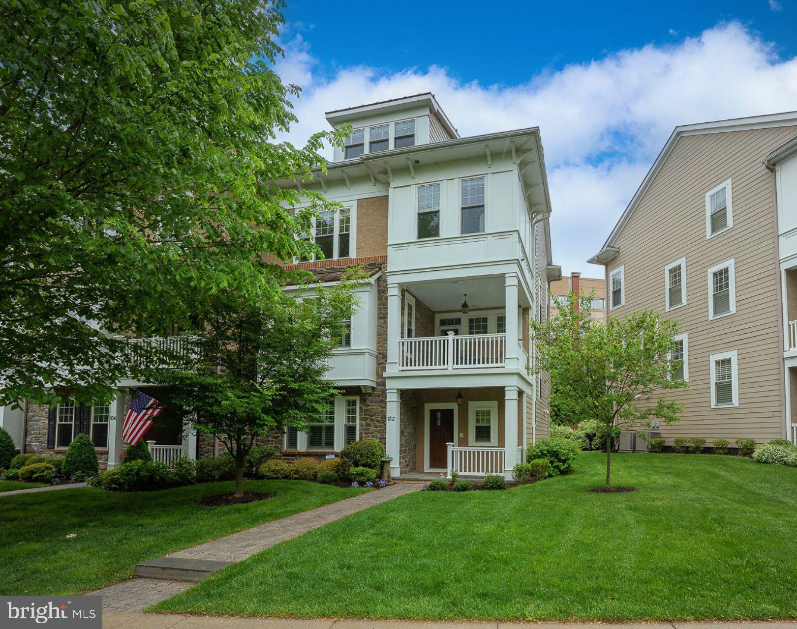 Welcome to 132 Pennsylvania Avenue, an exquisite Harriton Model end-unit townhouse in the highly desirable Whitehall community of Bryn Mawr. Built in 2012 by Vaughan Building Group, this 3 Bedroom, 3.2 Bath residence sits on a prime corner lot along a beautiful tree-lined street, offering exceptional privacy with ample space between homes and a highly walkable location—steps to the R-5 train, shopping, dining, parks, and cultural venues.
The welcoming entry sets the tone with a charming covered front porch, a bright Foyer, a versatile Den/Office perfect for working from home or relaxing, a utility closet, and direct access to the oversized 2-Car Garage. One of only two homes in the community with a Powder Room on this level, it offers exceptional everyday convenience.
The main living level is bright and open, featuring a fabulous Great Room that serves as the home's primary Living and Dining area. Soaring windows flood the space with natural light, while a gas fireplace, custom built-in bookcases, extensive hardwood flooring, elegant double crown molding, and tall baseboards create a polished, inviting setting. The adjacent designer Kitchen boasts Kountry Kraft custom cabinetry, a mantel-style wood hood, granite countertops, a tile backsplash, and a Bosch stainless steel appliance suite, including a 5-burner gas cooktop and wall ovens, complemented by a JennAir refrigerator. A large center island with seating for four anchors the space, complemented by a bright Breakfast Area perfect for casual meals, along with a pantry closet and a second Powder Room for added convenience.
Upstairs, the spacious Primary Suite offers outfitted walk-in closets and a luxurious ensuite Bath featuring a Kohler soaking tub, oversized frameless glass shower, granite-topped vanities, and rich ceramic tile finishes. Rounding out this level is a second Bedroom with its own Jack-and-Jill style Bath and an easily accessible Laundry Room.
The next level offers flexibility and space with a grand Loft Bedroom featuring its own ensuite Bath, a built-in desk area ideal for a second Home Office, multiple closets, and a finished oversized attic for abundant storage.
Throughout the home, thoughtful upgrades enhance comfort and security, including 9-foot ceilings, a whole-house Sonos sound system with speakers on the balcony, intercom connecting the front door to every level, a security system, fire sprinklers, and smart sensors on the hot water heater, washer, and elevator. The private Savaria elevator, elegantly finished to match the rich hardwood floors, provides effortless access to all levels.
One of the most treasured features is the expansive private Balcony—the largest in the community—it comfortably seats six (Brown Jordan table and 4 chairs included), perfect for enjoying morning coffee, al fresco dining, or simply relaxing while taking in serene views.
This home, thoughtfully maintained by its original owners and the very first home purchased in Whitehall, also benefits from important recent improvements: a freshly painted interior, brand-new carpeting in the Primary Bedroom, a new hot water heater, and a two-year-old heating and air conditioning system—ensuring a move-in ready experience for the next owners.
The oversized attached 2-Car Garage, accessed via a rear driveway, provides easy entry and includes space for two additional parking spots.
Situated within walking distance of Bryn Mawr Village, this location offers the perfect blend of suburban tranquility and urban convenience. Enjoy boutique shopping, fine dining, the Bryn Mawr Film Institute, Starbucks, a vibrant weekly farmers market, Bryn Mawr Hospital, and convenient access to public transportation. 132 Pennsylvania Avenue is a truly special offering in the heart of Bryn Mawr!