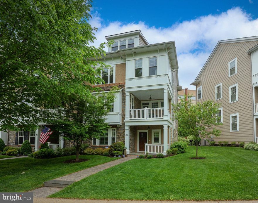 Welcome to 132 Pennsylvania Avenue, an exquisite Harriton Model end-unit townhouse in the highly desirable Whitehall community of Bryn Mawr. Built in 2012 by Vaughan Building Group, this 3 Bedroom, 3.2 Bath residence sits on a prime corner lot along a beautiful tree-lined street, offering exceptional privacy with ample space between homes and a highly walkable location—steps to the R-5 train, shopping, dining, parks, and cultural venues.
The welcoming entry sets the tone with a charming covered front porch, a bright Foyer, a versatile Den/Office perfect for working from home or relaxing, a utility closet, and direct access to the oversized 2-Car Garage. One of only two homes in the community with a Powder Room on this level, it offers exceptional everyday convenience.
The main living level is bright and open, featuring a fabulous Great Room that serves as the home's primary Living and Dining area. Soaring windows flood the space with natural light, while a gas fireplace, custom built-in bookcases, extensive hardwood flooring, elegant double crown molding, and tall baseboards create a polished, inviting setting. The adjacent designer Kitchen boasts Kountry Kraft custom cabinetry, a mantel-style wood hood, granite countertops, a tile backsplash, and a Bosch stainless steel appliance suite, including a 5-burner gas cooktop and wall ovens, complemented by a JennAir refrigerator. A large center island with seating for four anchors the space, complemented by a bright Breakfast Area perfect for casual meals, along with a pantry closet and a second Powder Room for added convenience. 
Upstairs, the spacious Primary Suite offers outfitted walk-in closets and a luxurious ensuite Bath featuring a Kohler soaking tub, oversized frameless glass shower, granite-topped vanities, and rich ceramic tile finishes. Rounding out this level is a second Bedroom with its own Jack-and-Jill style Bath and an easily accessible Laundry Room. 
The next level offers flexibility and space with a grand Loft Bedroom featuring its own ensuite Bath, a built-in desk area ideal for a second Home Office, multiple closets, and a finished oversized attic for abundant storage.
Throughout the home, thoughtful upgrades enhance comfort and security, including 9-foot ceilings, a whole-house Sonos sound system with speakers on the balcony, intercom connecting the front door to every level, a security system, fire sprinklers, and smart sensors on the hot water heater, washer, and elevator. The private Savaria elevator, elegantly finished to match the rich hardwood floors, provides effortless access to all levels.
One of the most treasured features is the expansive private Balcony—the largest in the community—it comfortably seats six (Brown Jordan table and 4 chairs included), perfect for enjoying morning coffee, al fresco dining, or simply relaxing while taking in serene views.
This home, thoughtfully maintained by its original owners and the very first home purchased in Whitehall, also benefits from important recent improvements: a freshly painted interior, brand-new carpeting in the Primary Bedroom, a new hot water heater, and a two-year-old heating and air conditioning system—ensuring a move-in ready experience for the next owners.
The oversized attached 2-Car Garage, accessed via a rear driveway, provides easy entry and includes space for two additional parking spots.
Situated within walking distance of Bryn Mawr Village, this location offers the perfect blend of suburban tranquility and urban convenience. Enjoy boutique shopping, fine dining, the Bryn Mawr Film Institute, Starbucks, a vibrant weekly farmers market, Bryn Mawr Hospital, and convenient access to public transportation. 132 Pennsylvania Avenue is a truly special offering in the heart of Bryn Mawr!